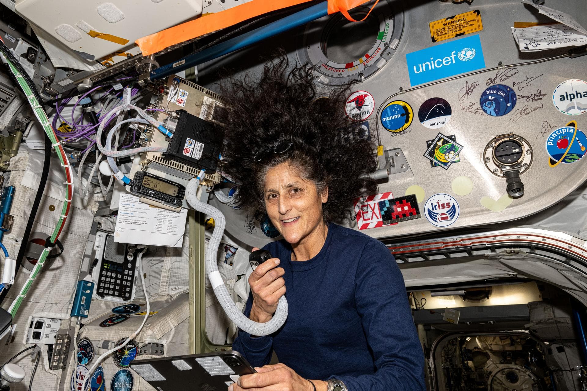 NASA astronaut and Boeing Crew Flight Test Pilot Suni Williams Suni Williams uses a HAM radio and talks to students from Banda Aceh, Indonesia, answering their questions about life in space and other 