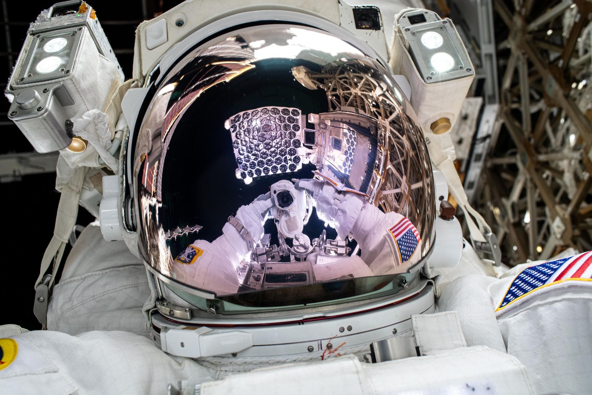 iss072e487911 (Jan. 16, 2025) --- The NICER X-ray telescope is reflected on NASA astronaut and Expedition 72 Flight Engineer Nick Hague's spacesuit helmet visor in this high-flying "space-selfie." Als