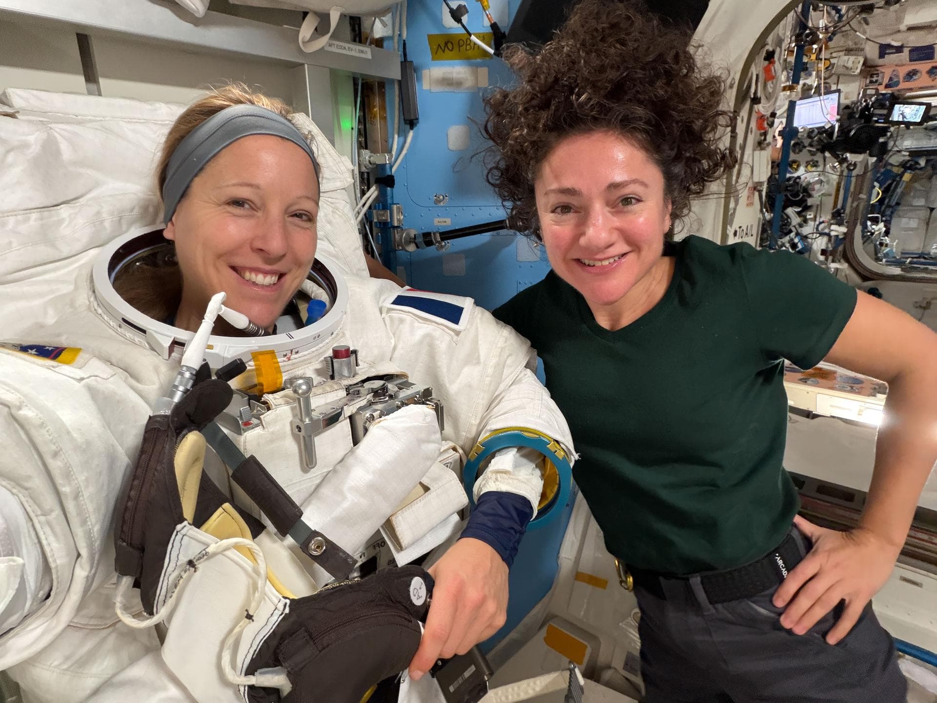 iss074e0437872 (April 3, 2026) --- Expedition 74 flight engineers Sophie Adenot of ESA (European Space Agency) and Jessica Meir of NASA pose for a portrait inside the International Space Station’s Que