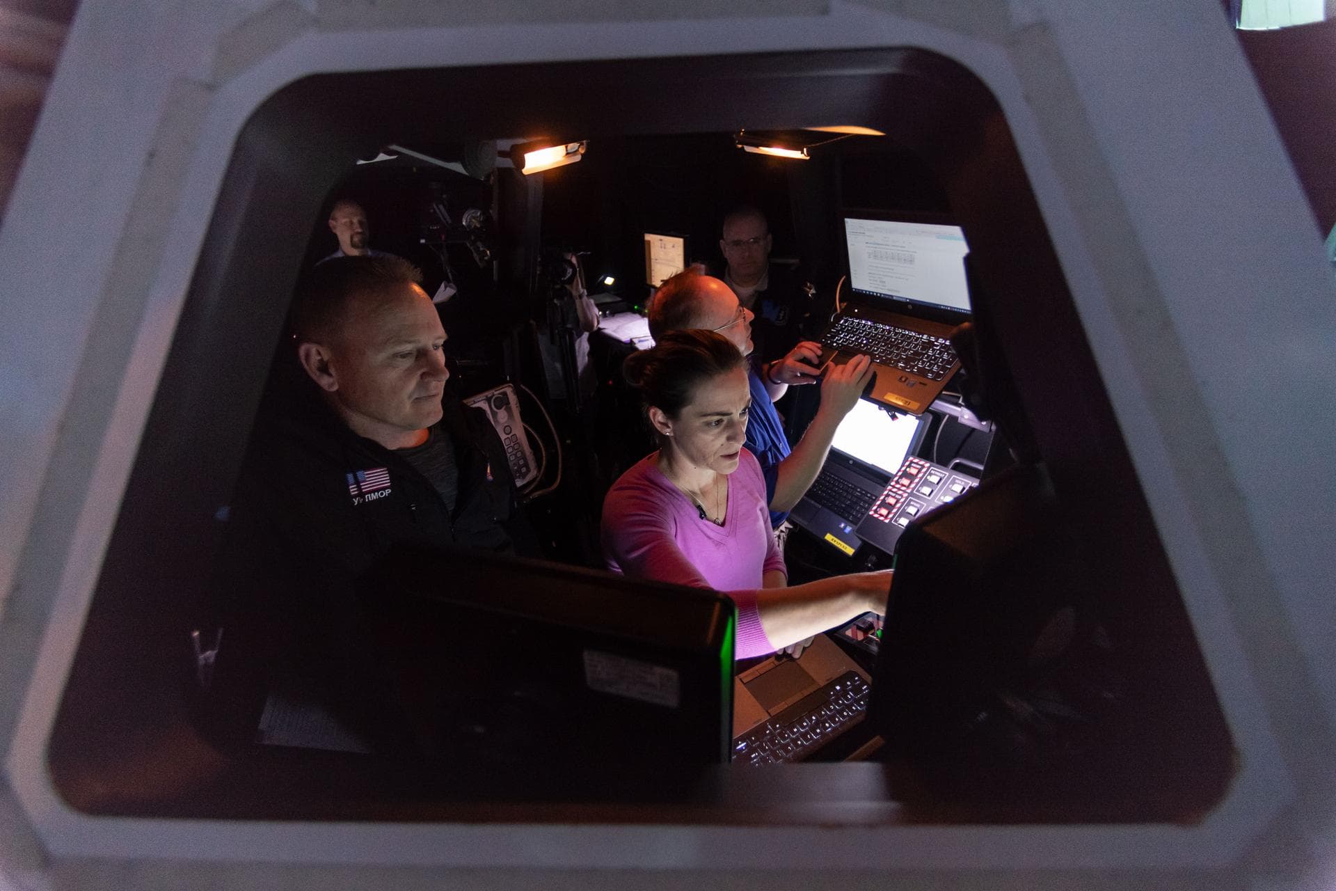 Commercial Crew Program astronauts Mike Fincke, Nicole Mann and Barry "Butch" Wilmore in Free Flyer Track & Capture Sim training in SES Alpha Cupola.