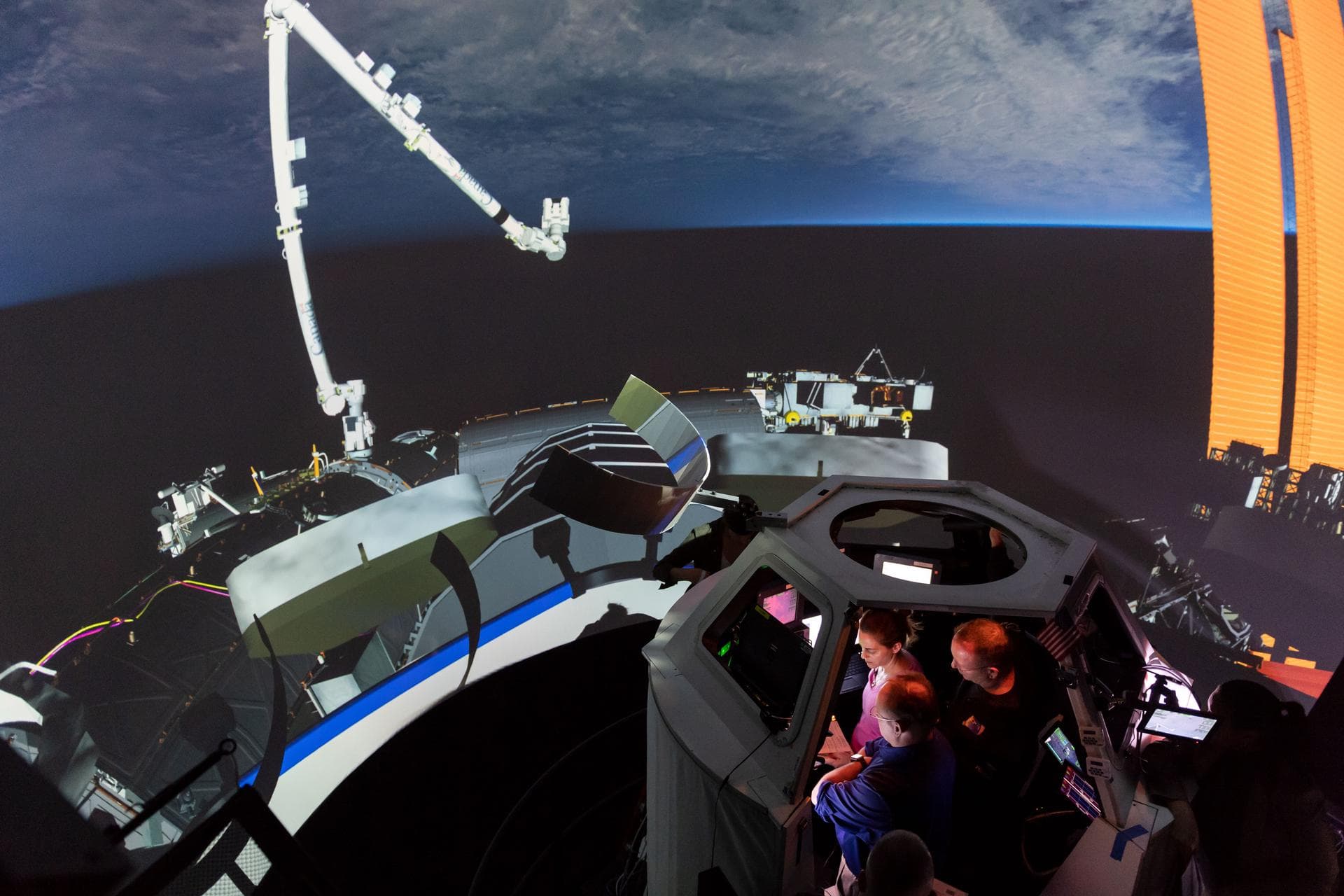 Commercial Crew Program astronauts Mike Fincke, Nicole Mann and Barry "Butch" Wilmore in Free Flyer Track & Capture Sim training in SES Alpha Cupola. 