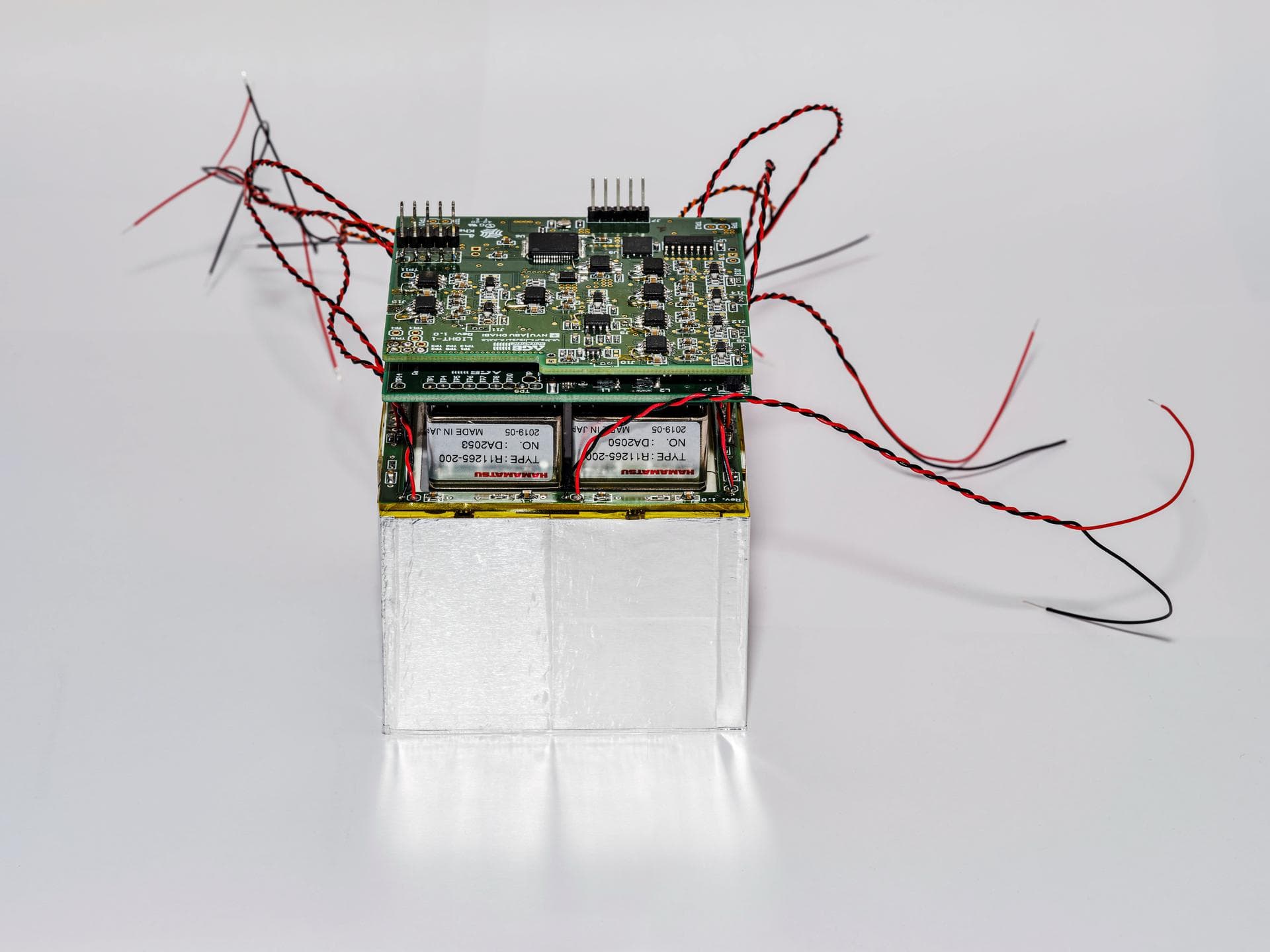 jsc2021e059256 (11/19/2021) --- The inner structure of the PMT payload. The Light-1 CubeSat focuses on the detection of Terrestrial Gamma-ray Flashes (TGFs) coming from the Earth’s atmosphere. Image C