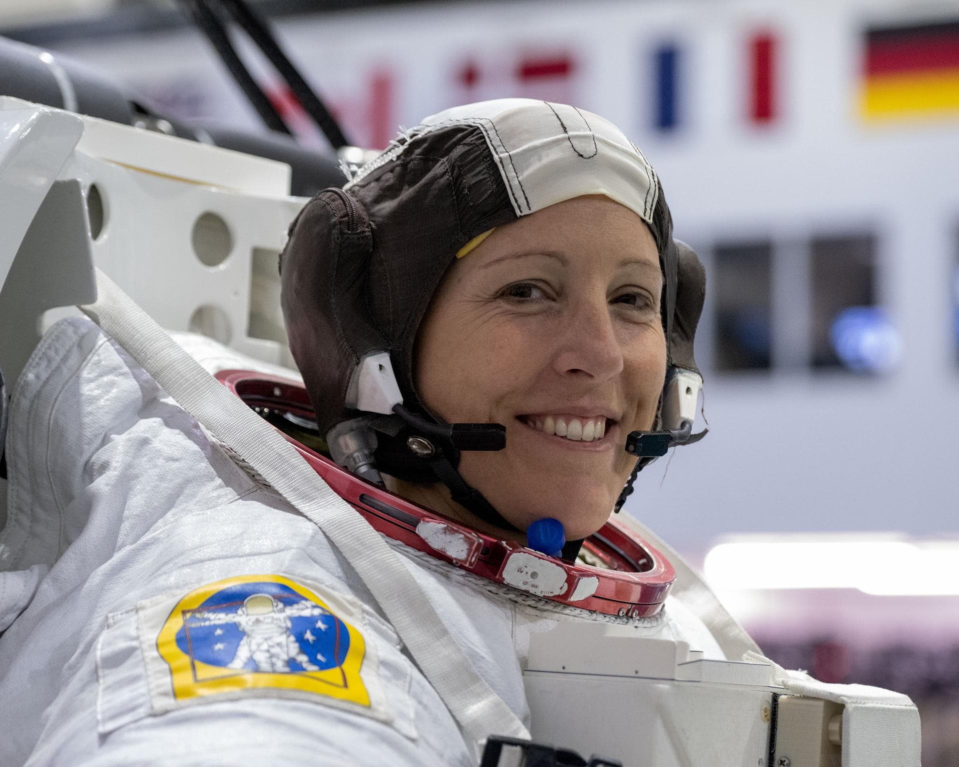 jsc2024e062537 (Sept. 20, 2024) --- ESA (European Space Agency) astronaut Sophie Adenot smiles for a portrait as she gets suited up for a spacewalk training session at Johnson Space Center's Neutral B