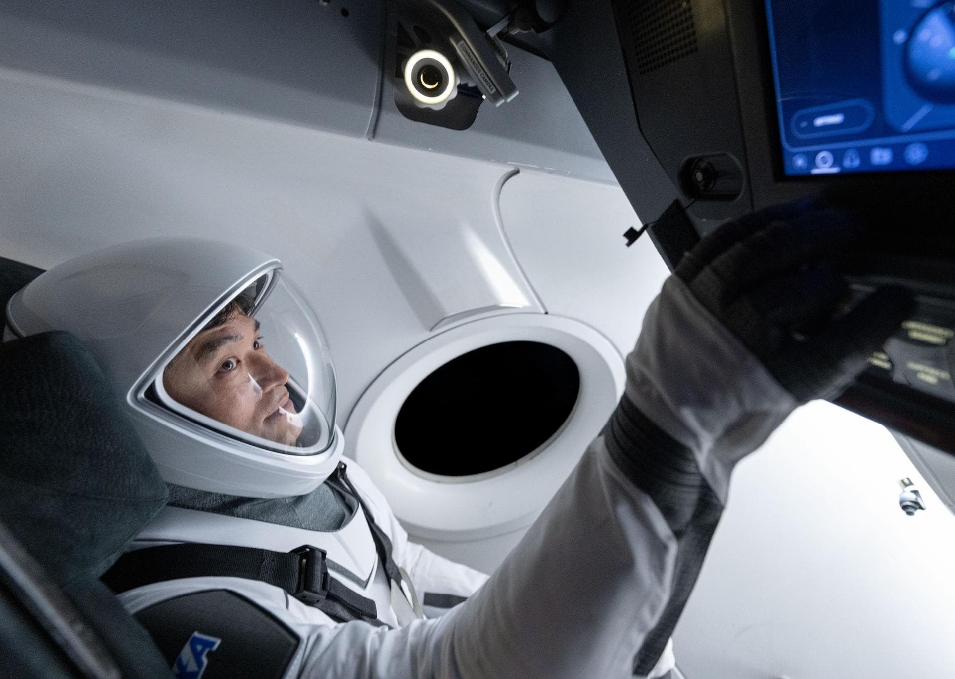 jsc2024e079793 (Nov. 20, 2024) --- NASA’s SpaceX Crew-10 Mission Specialist Takuya Onishi of JAXA (Japan Aerospace Exploration Agency) is pictured training inside a mockup of a Dragon cockpit at the c
