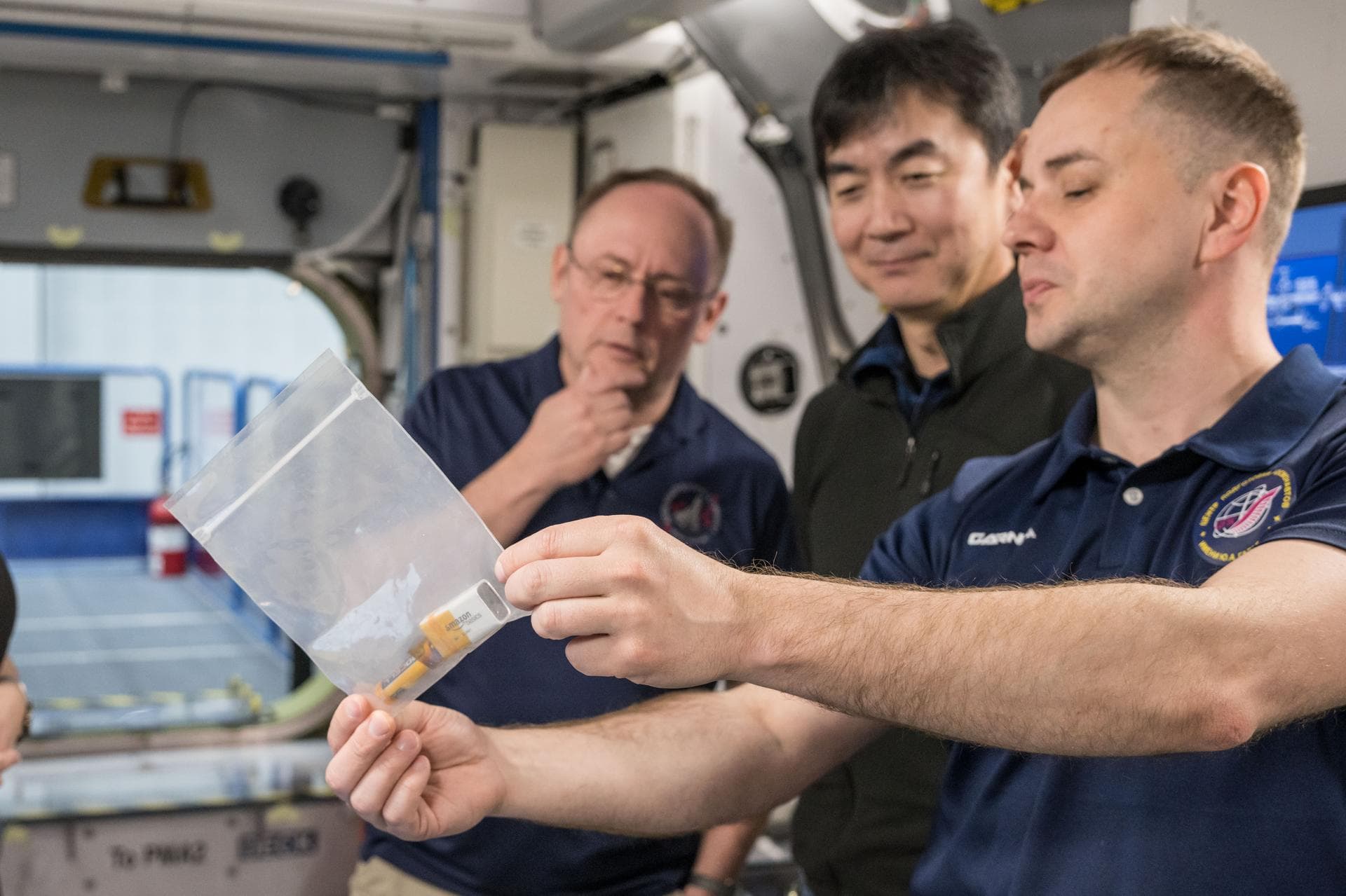 jsc2025e032872 (March 20, 2025) --- From left to right, NASA astronaut Mike Fincke, JAXA astronaut Kimiya Yui, and Roscosmos Cosmonaut Oleg Platonov conduct training scenarios inside a space station m