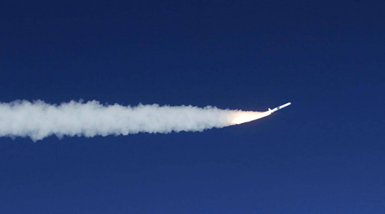 A Pegasus rocket starts it's first stage burn to propel the SORCE Satellite payload into low-Earth orbit, January 25, 2003, off the coast of Cape Canaveral, FL, The SORCE satellite, Solar Radiation an