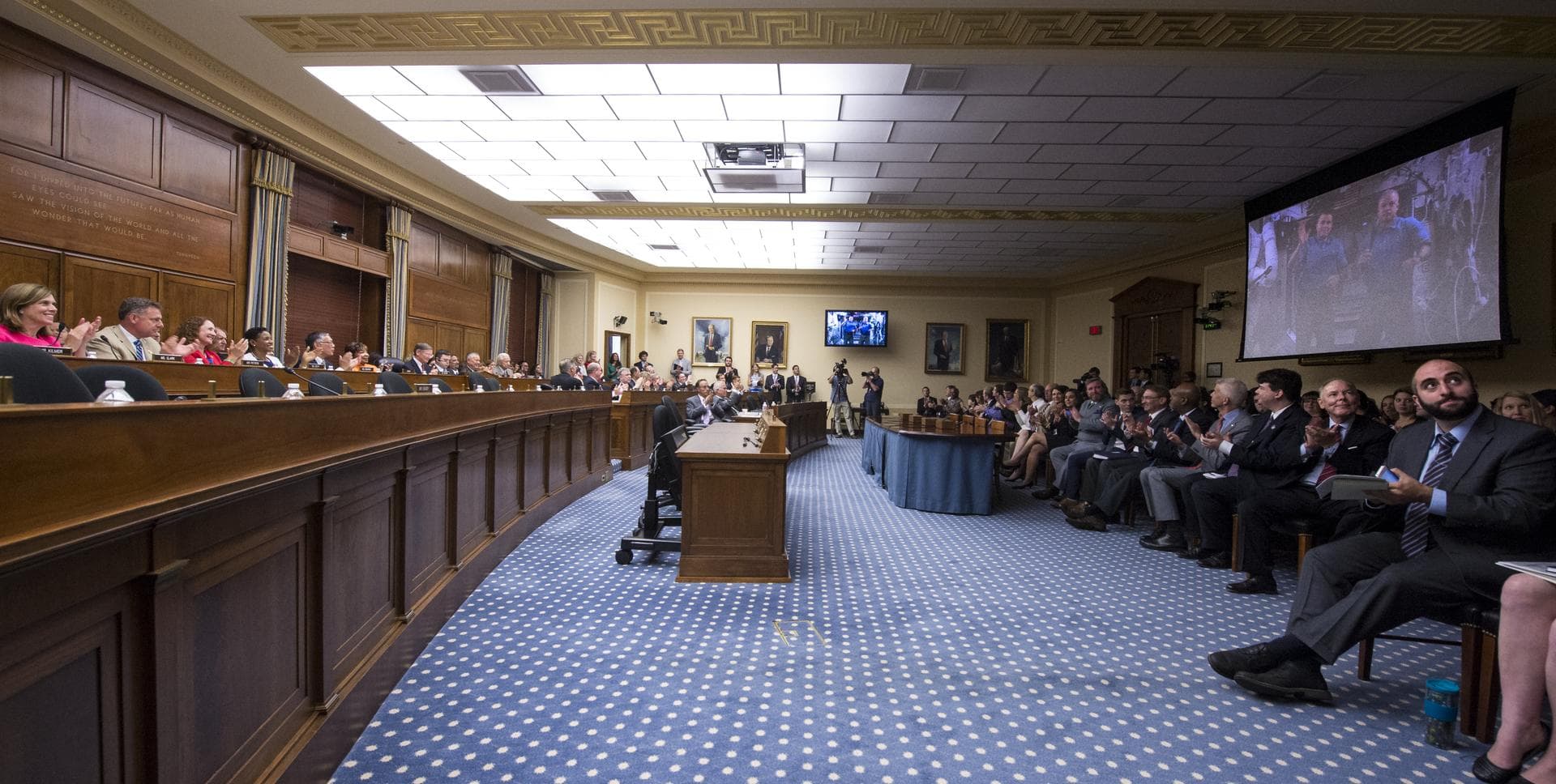 Congress and audience members applaud after a full-committee event held Thursday, July 24, 2014 at the Rayburn House Office Building in Washington, DC to allow members of the Committee on Science, Spa