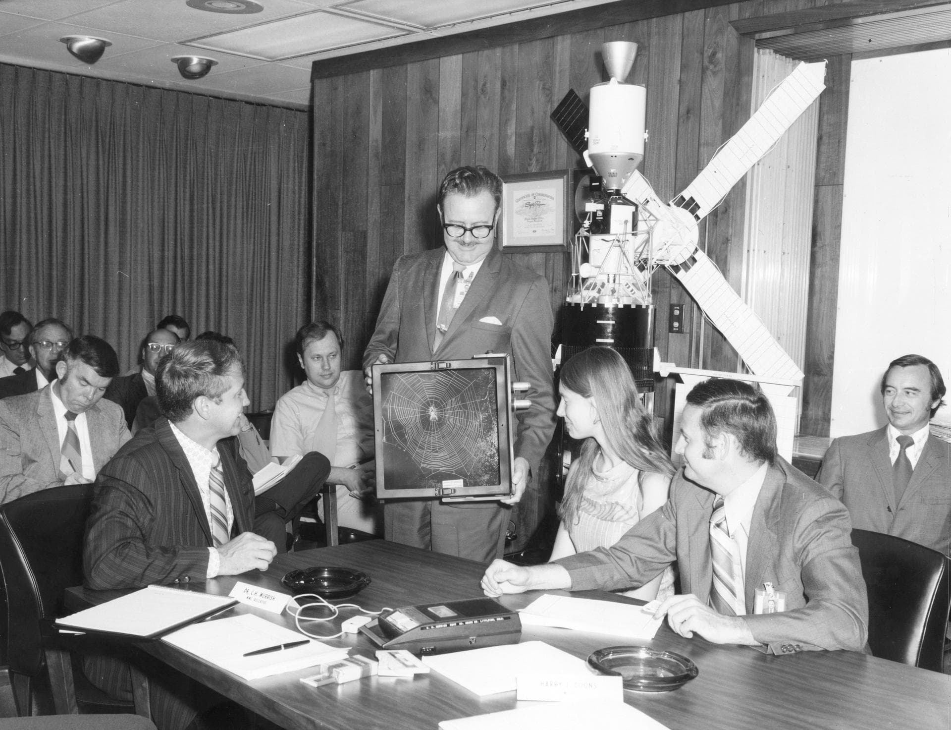 Lexington, Massachusetts high school student, Judith Miles, discusses her proposed Skylab experiment with engineers and scientists during a design review of the experiment equipment. At left is Ron P