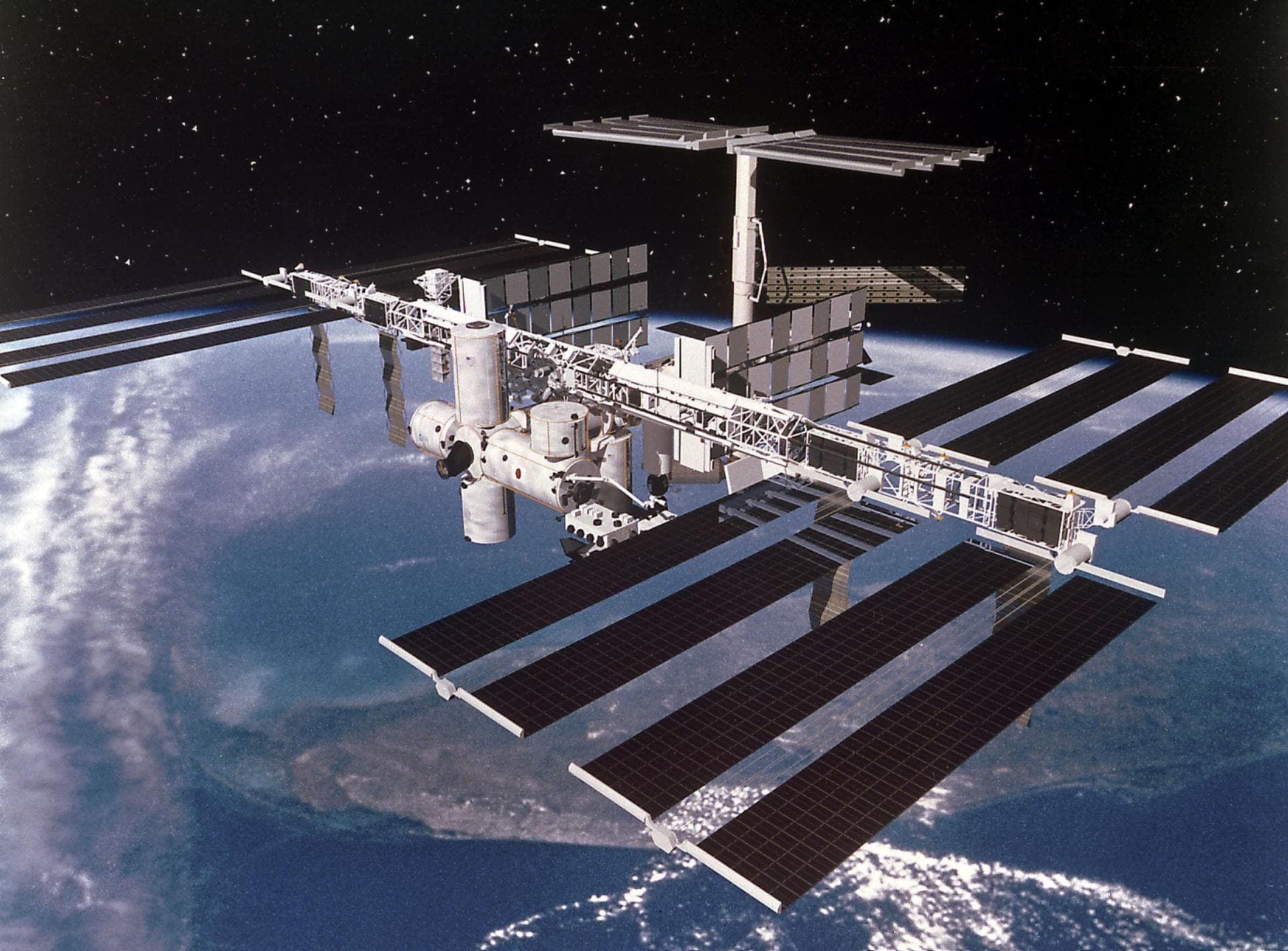 This artist's digital concept depicts the completely assembled International Space Station (ISS) passing over Florida. As a gateway to permanent human presence in space, the Space Station Program is t