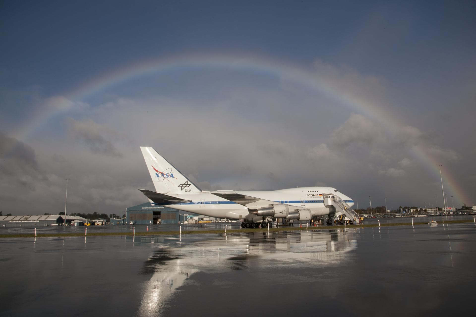 A rainbow frames the Stratospheric Observatory for Infrared Astronomy 747SP during its first Southern Hemisphere deployment in Christchurch, New Zealand, in July 2013.