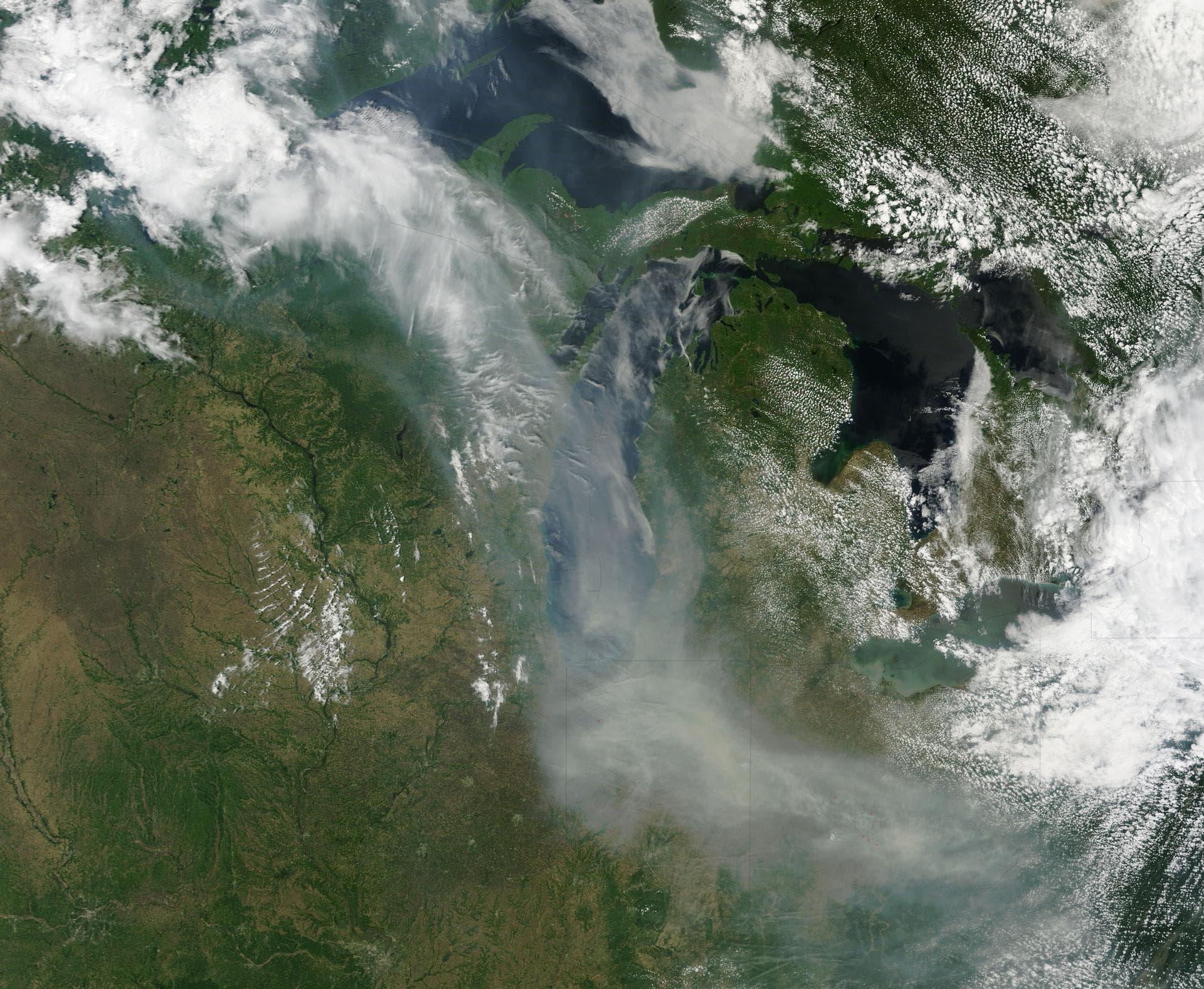 Canada has already had its share of wildfires this season, and the smoke from these wildfires is slowly drifting south over the United States' Midwest. The drifting smoke can be seen in this Terra sa