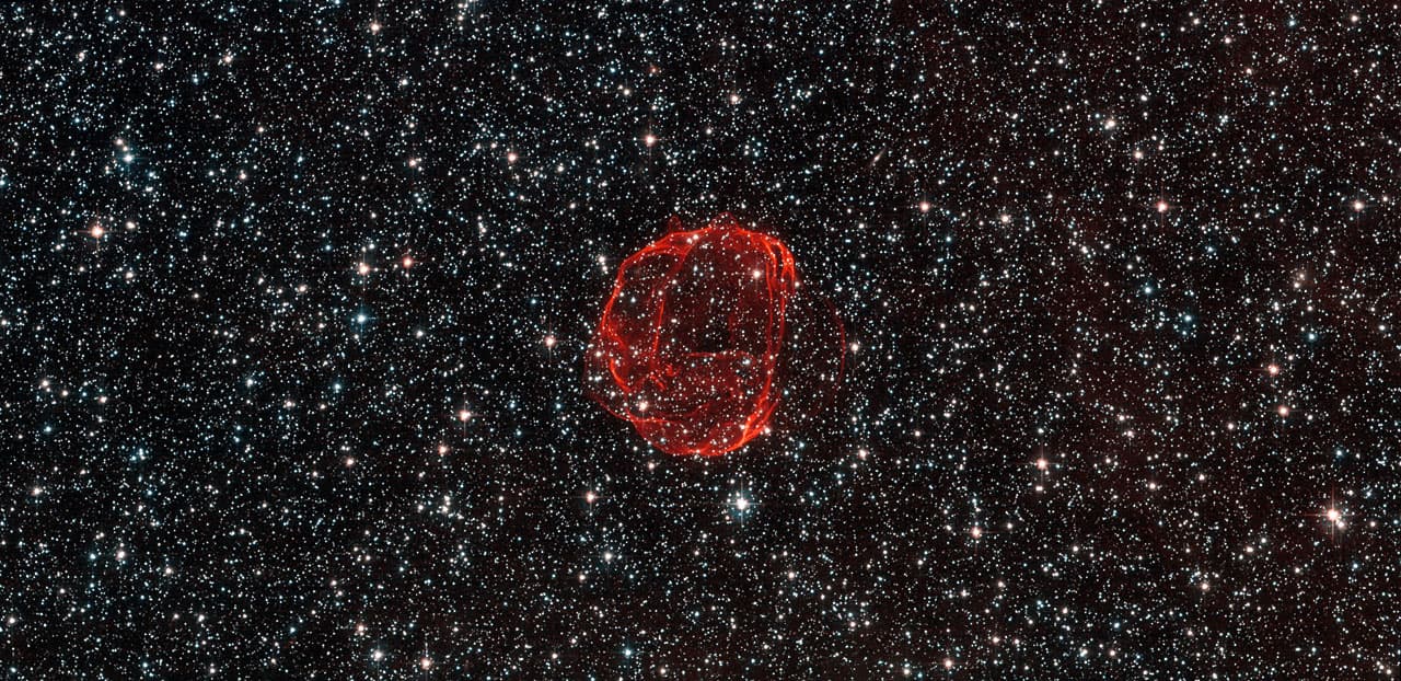 These delicate wisps of gas make up an object known as SNR B0519-69.0, or SNR 0519 for short. The thin, blood-red shells are actually the remnants from when an unstable progenitor star exploded violen