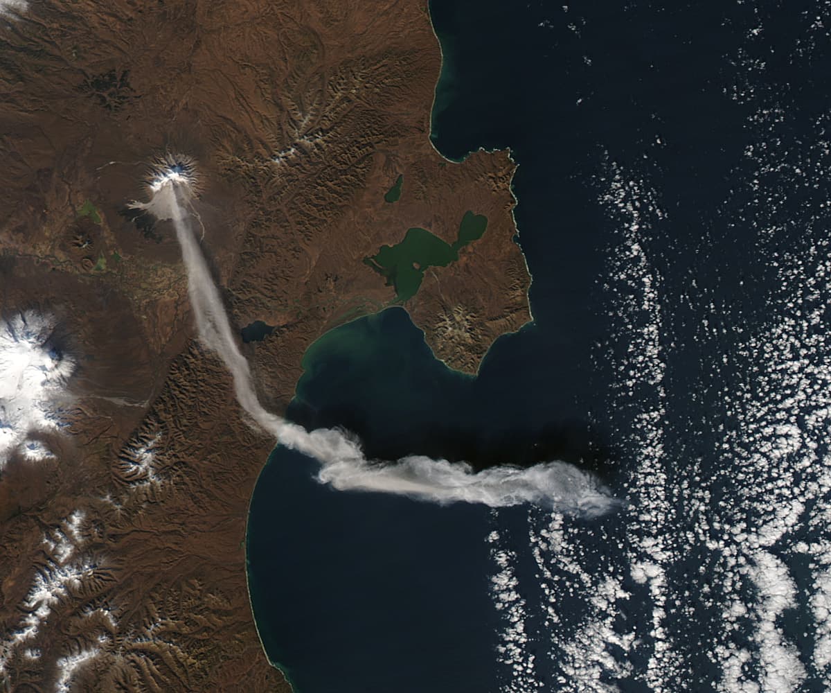 When NASA’s Terra satellite passed over Russia’s Kamchatka Peninsula at noon local time (00:00 Universal Time) on October 6, 2012, Shilveluch Volcano was quiet. By the time NASA’s Aqua satellite passe