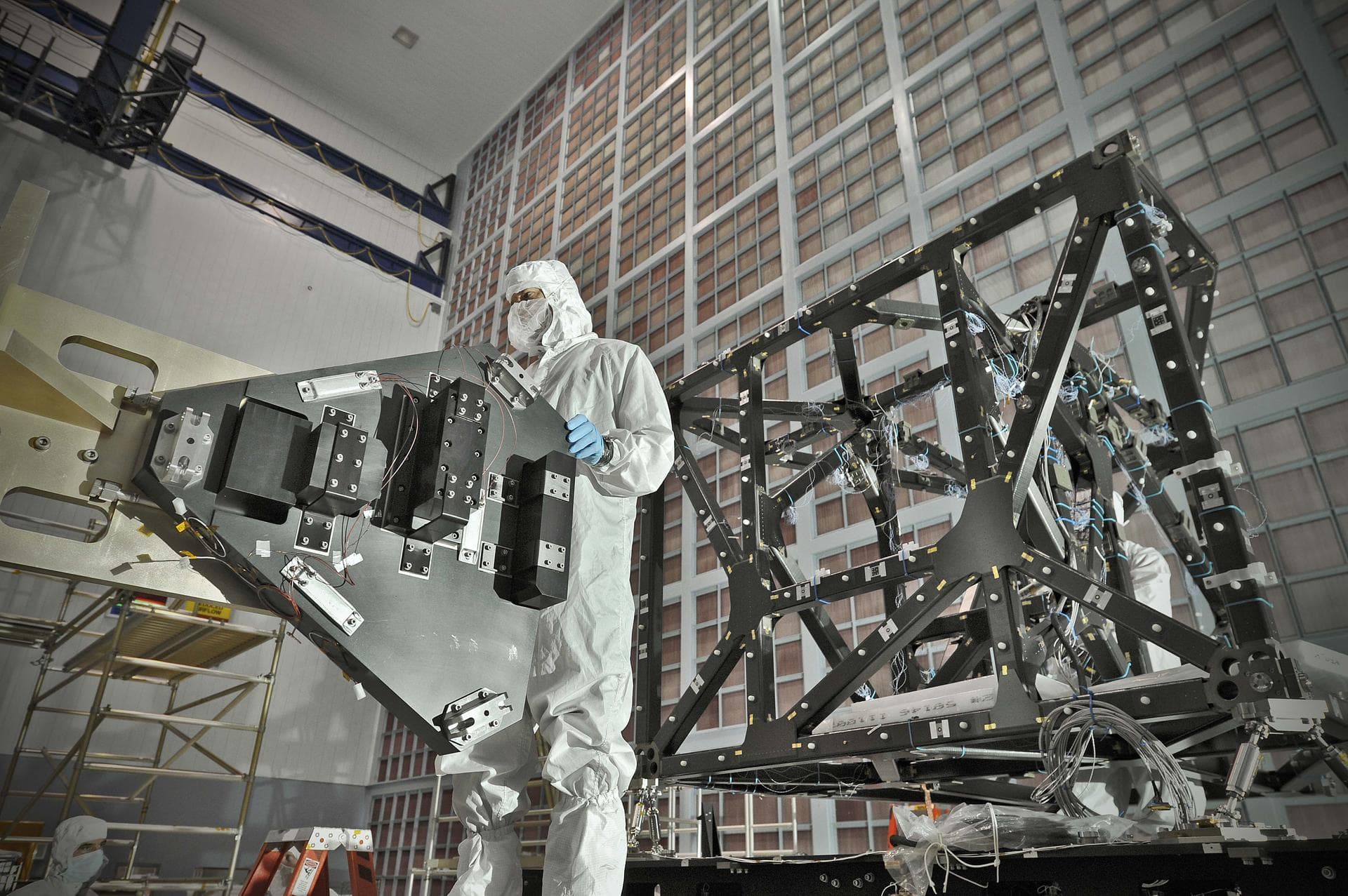 NASA image release September 17, 2010 In preparation for a cryogenic test NASA Goddard technicians install instrument mass simulators onto the James Webb Space Telescope ISIM structure. The ISIM Str