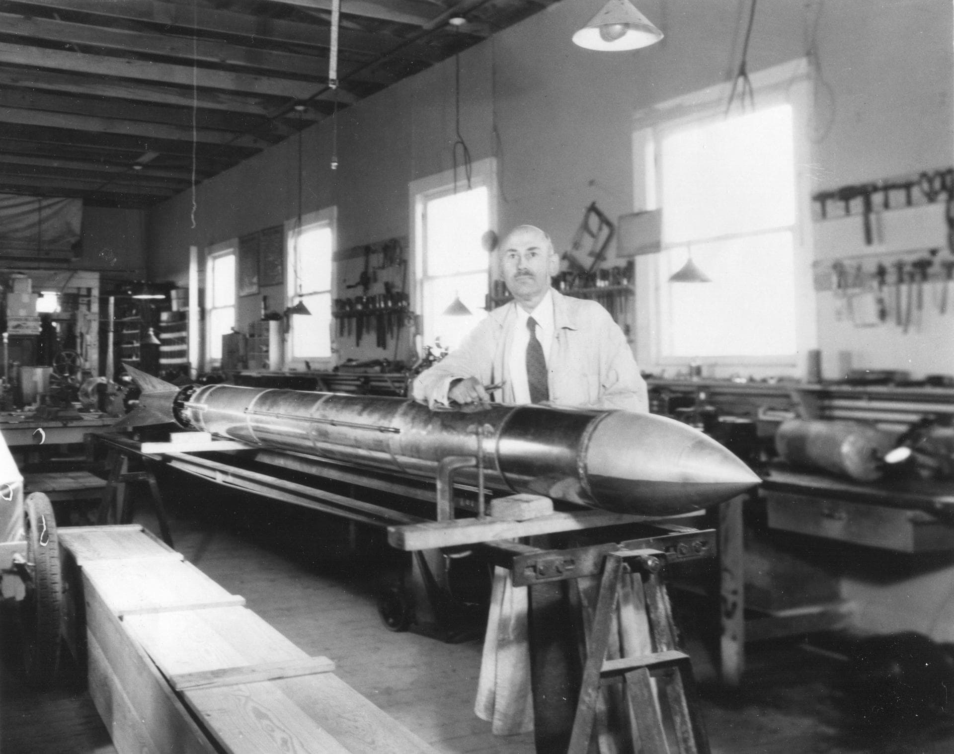 Goddard with a rocket in his workshop at Roswell, NM. October 1935. <b><a href="http://www.nasa.gov/centers/goddard/home/index.html" rel="nofollow">NASA Goddard Space Flight Center</a></b> enables N