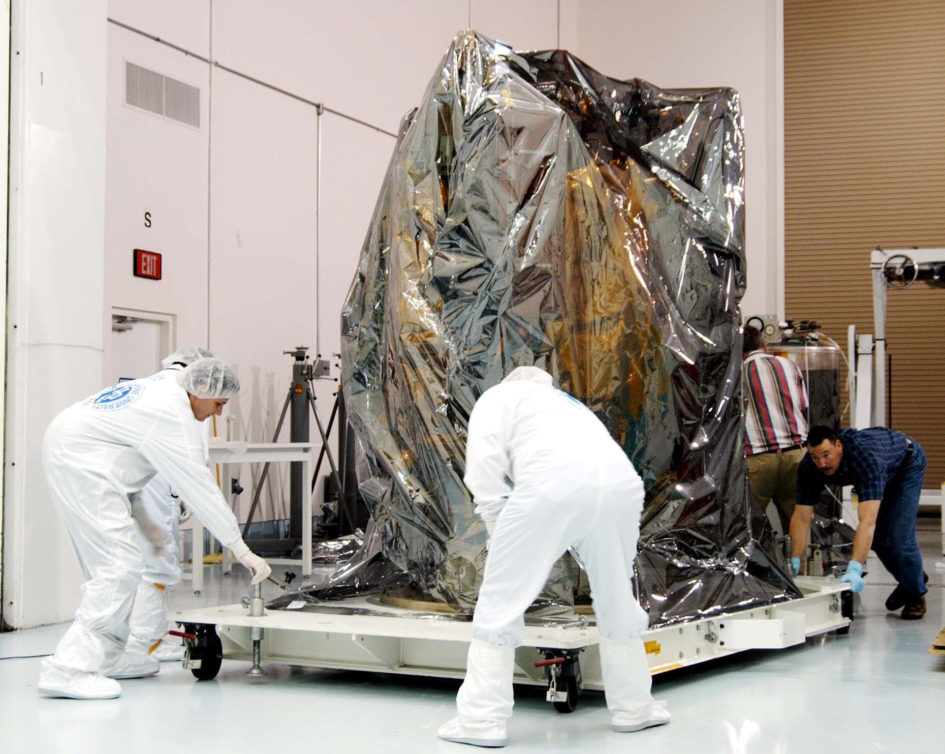 KENNEDY SPACE CENTER, FLA. - At the Astrotech Space Operations processing facilities near KSC, workers move NASA’s MESSENGER spacecraft into a high bay clean room. Employees of the Johns Hopkins Uni