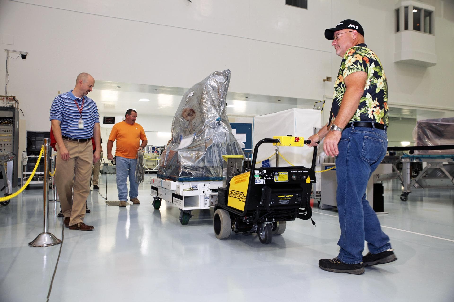 Inside the Space Station Processing Facility high bay at NASA's Kennedy Space Center in Florida, the Multiple User System for Earth Sensing, or MUSES, payload is being prepared for transfer out of the