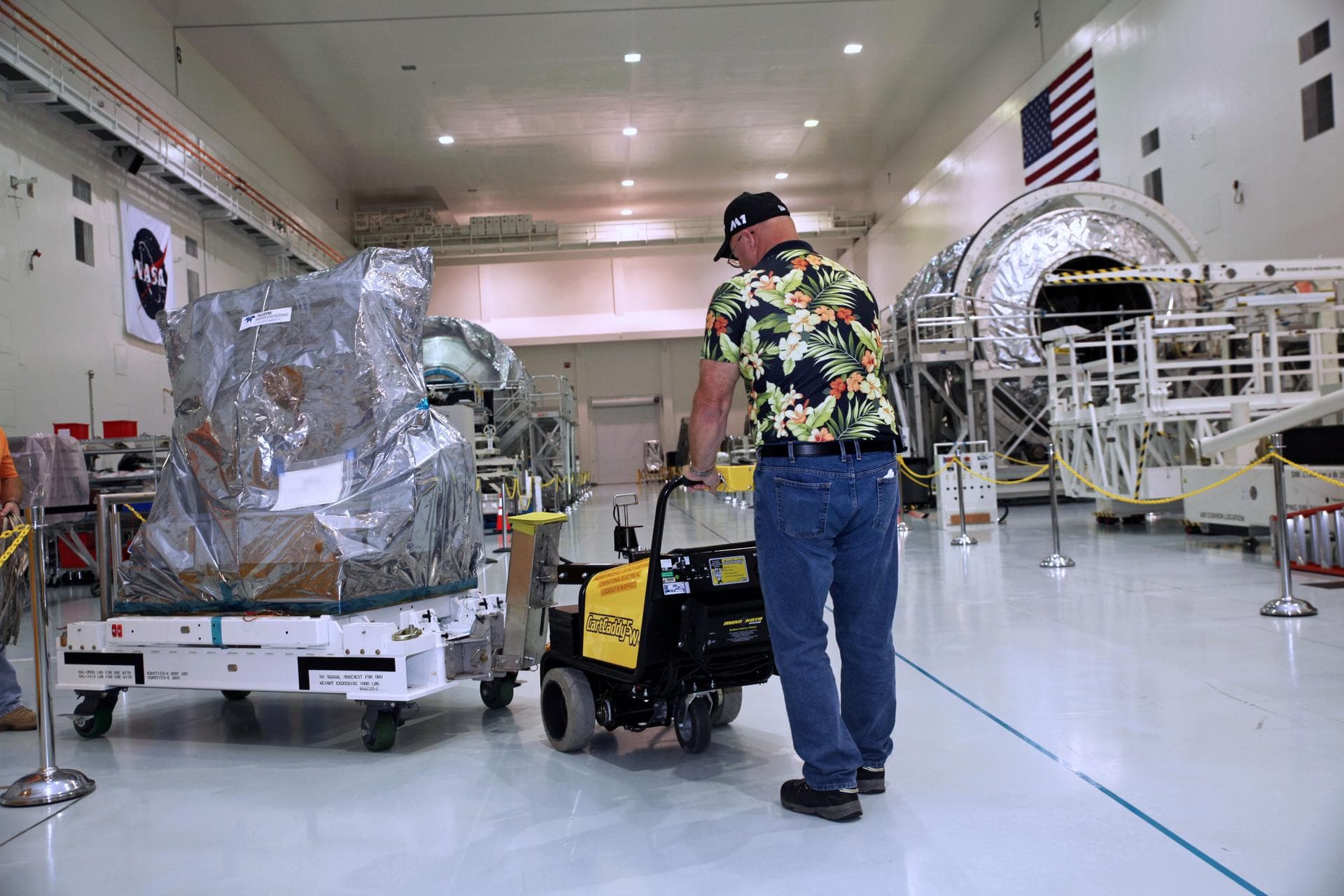 Inside the Space Station Processing Facility high bay at NASA's Kennedy Space Center in Florida, the Multiple User System for Earth Sensing, or MUSES, payload is being prepared for transfer out of the