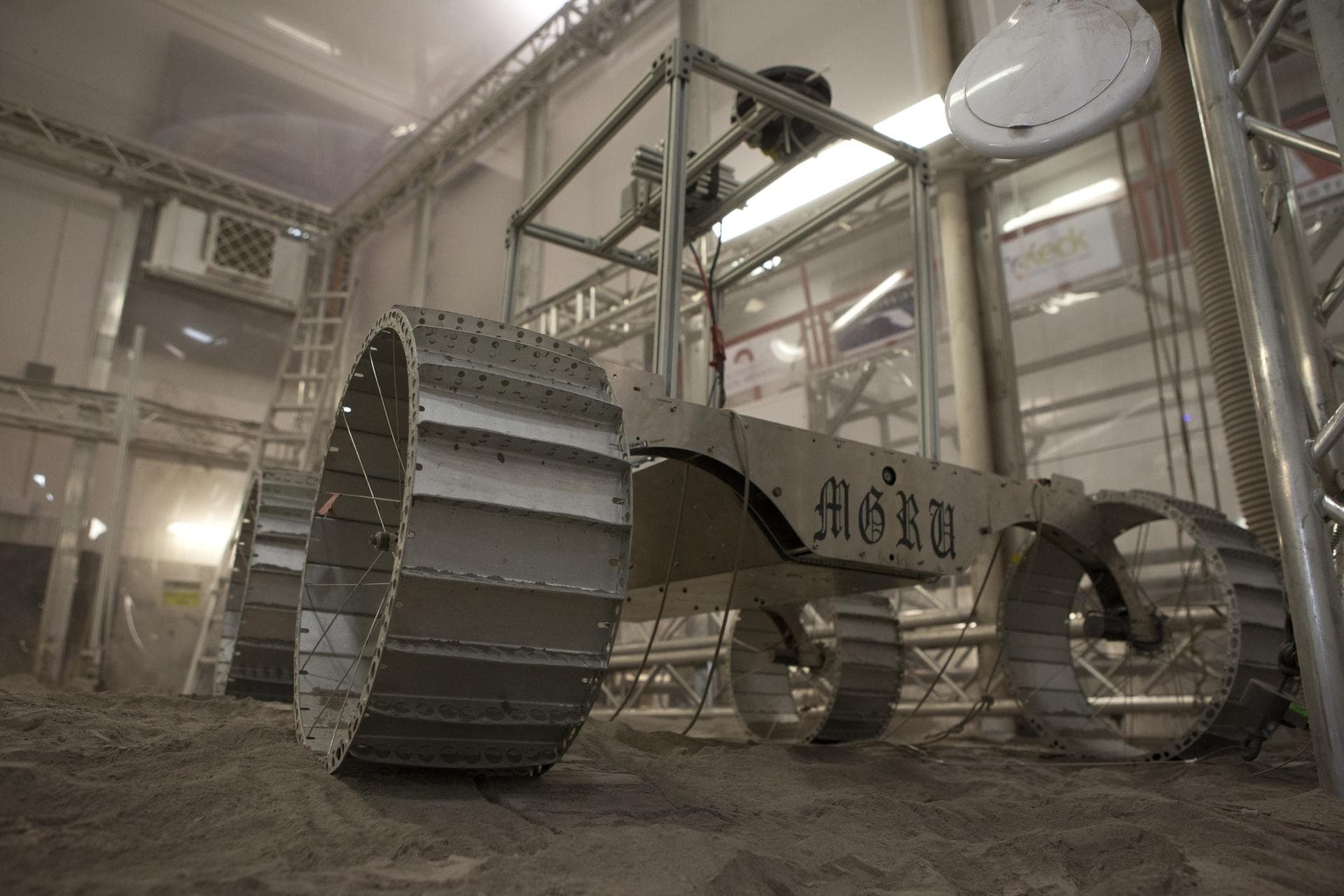 A lightweight simulator version of NASA's Resource Prospector undergoes a mobility test in a regolith bin at the agency's Kennedy Space center in Florida. The Resource Prospector mission aims to be th