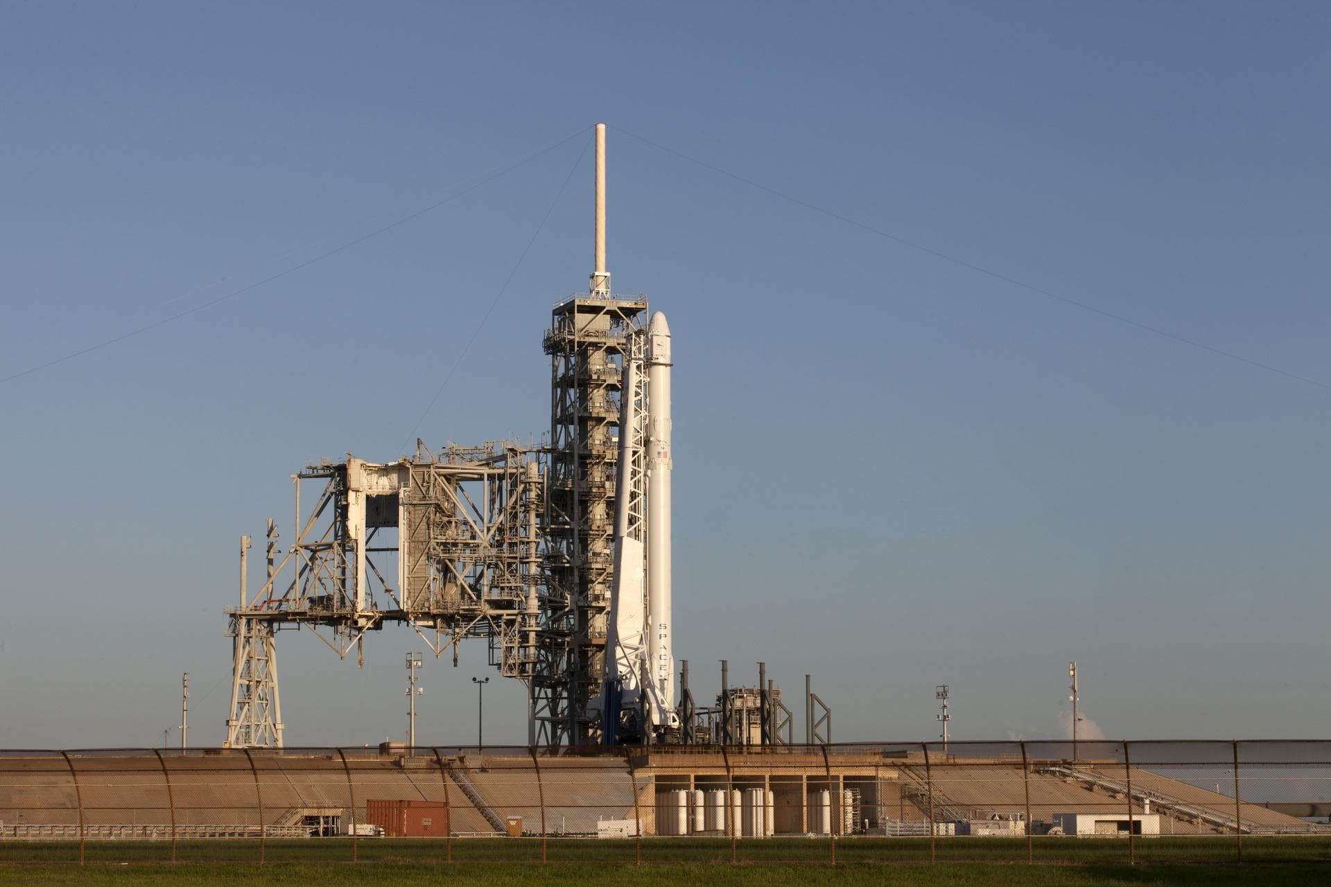 As a Falcon 9 rocket stands ready for liftoff at the Kennedy Space Center's Launch Complex 39A. The rocket will boost a Dragon resupply spacecraft to the International Space Station. Liftoff is schedu
