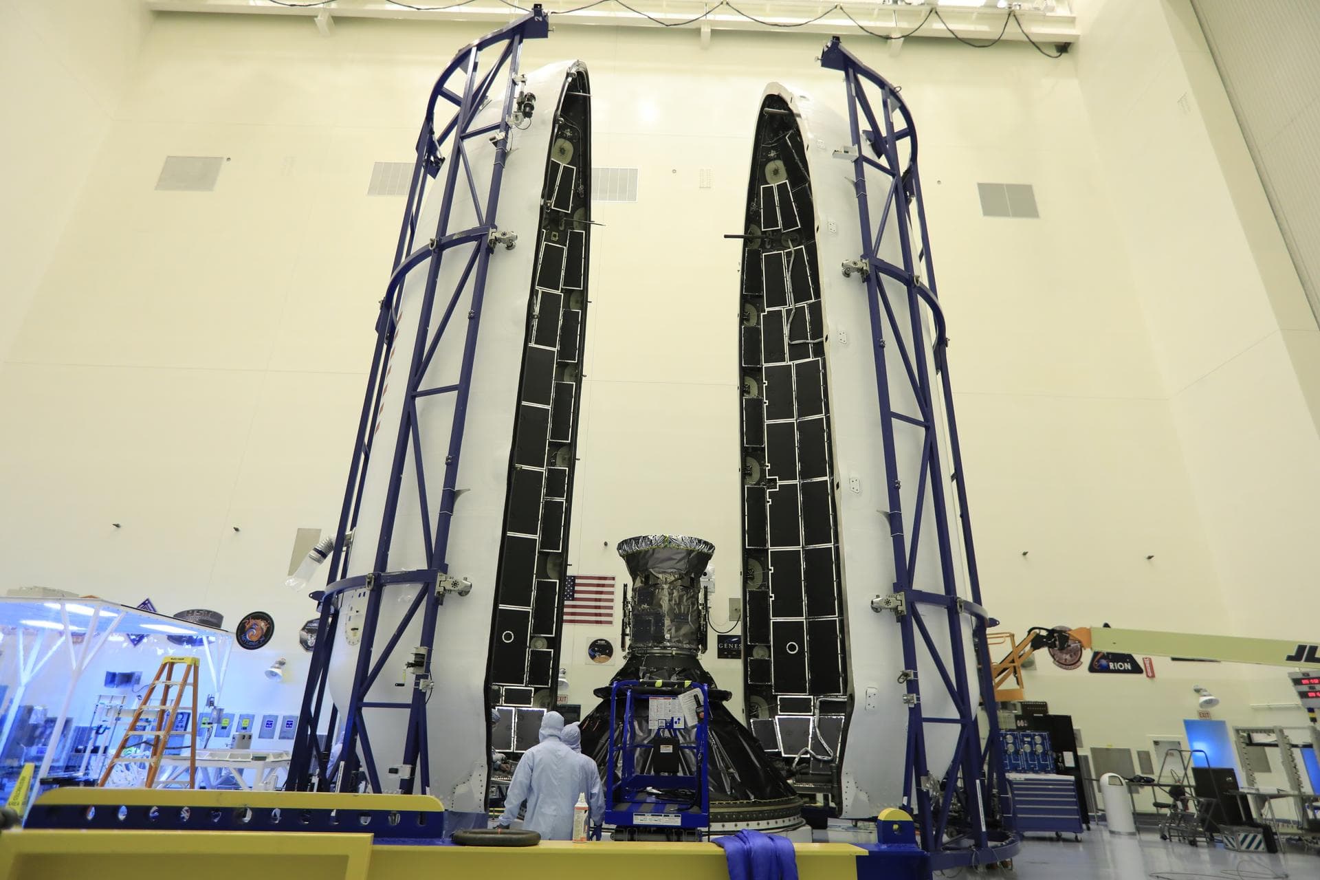 Technicians prepare NASA's Transiting Exoplanet Survey Satellite (TESS) for encapsulation in the SpaceX payload fairing inside the Payload Hazardous Servicing Facility at the agency's Kennedy Space Ce