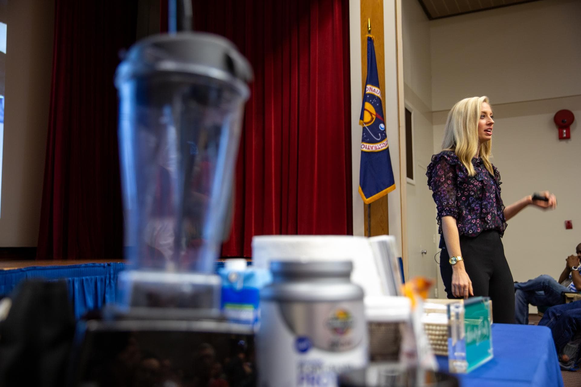 Carly Paige, an integrative nutrition health coach and chef, speaks to Kennedy Space Center employees inside the Florida spaceport’s Training Auditorium on March 5, 2020, during the center’s annual Sa