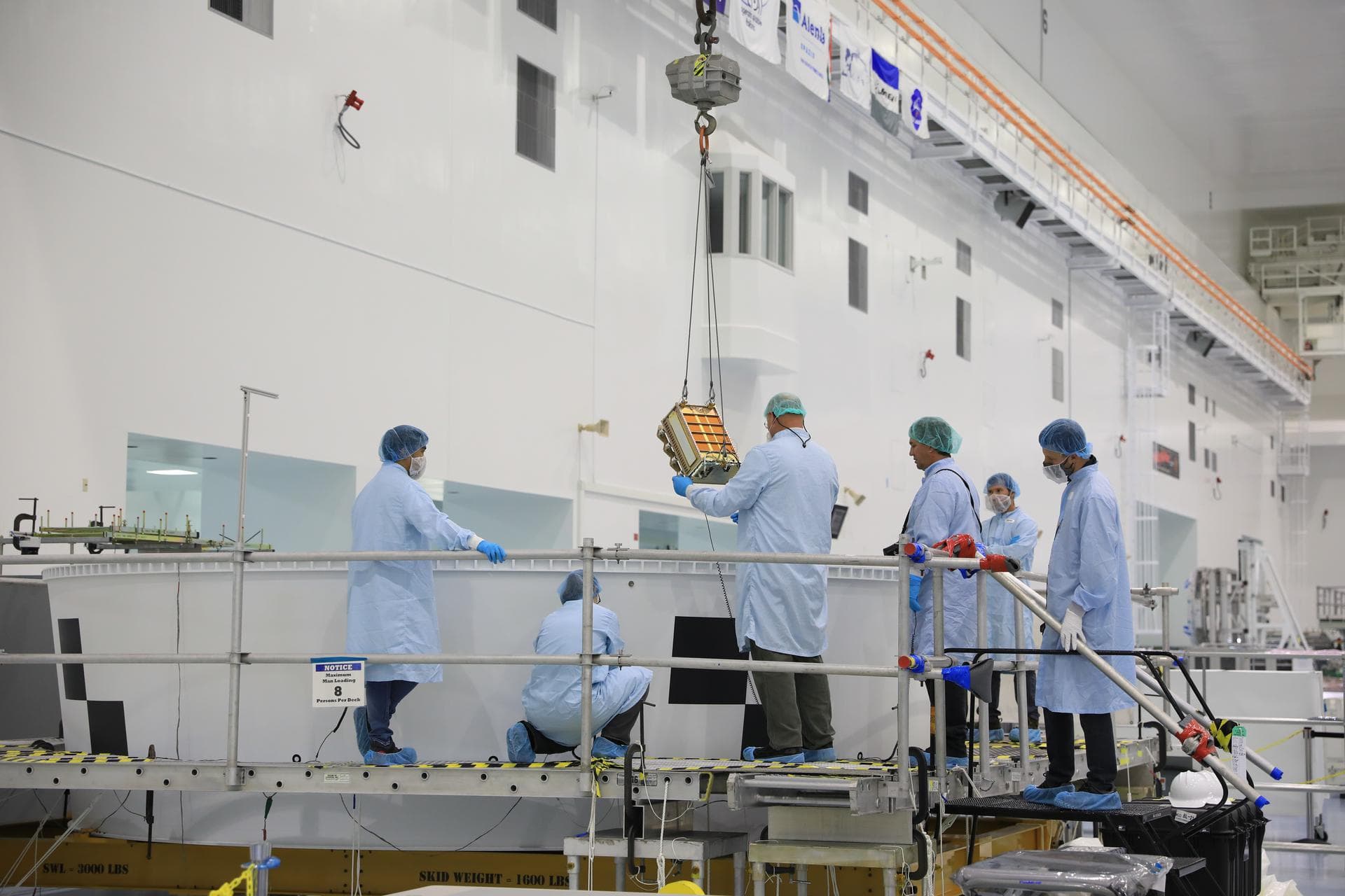 The NEA Scout and Lunar IceCube secondary payloads are the first to be installed in the Space Launch System (SLS) rocket’s Orion stage adapter for the Artemis I mission on July 14 at NASA’s Kennedy Sp