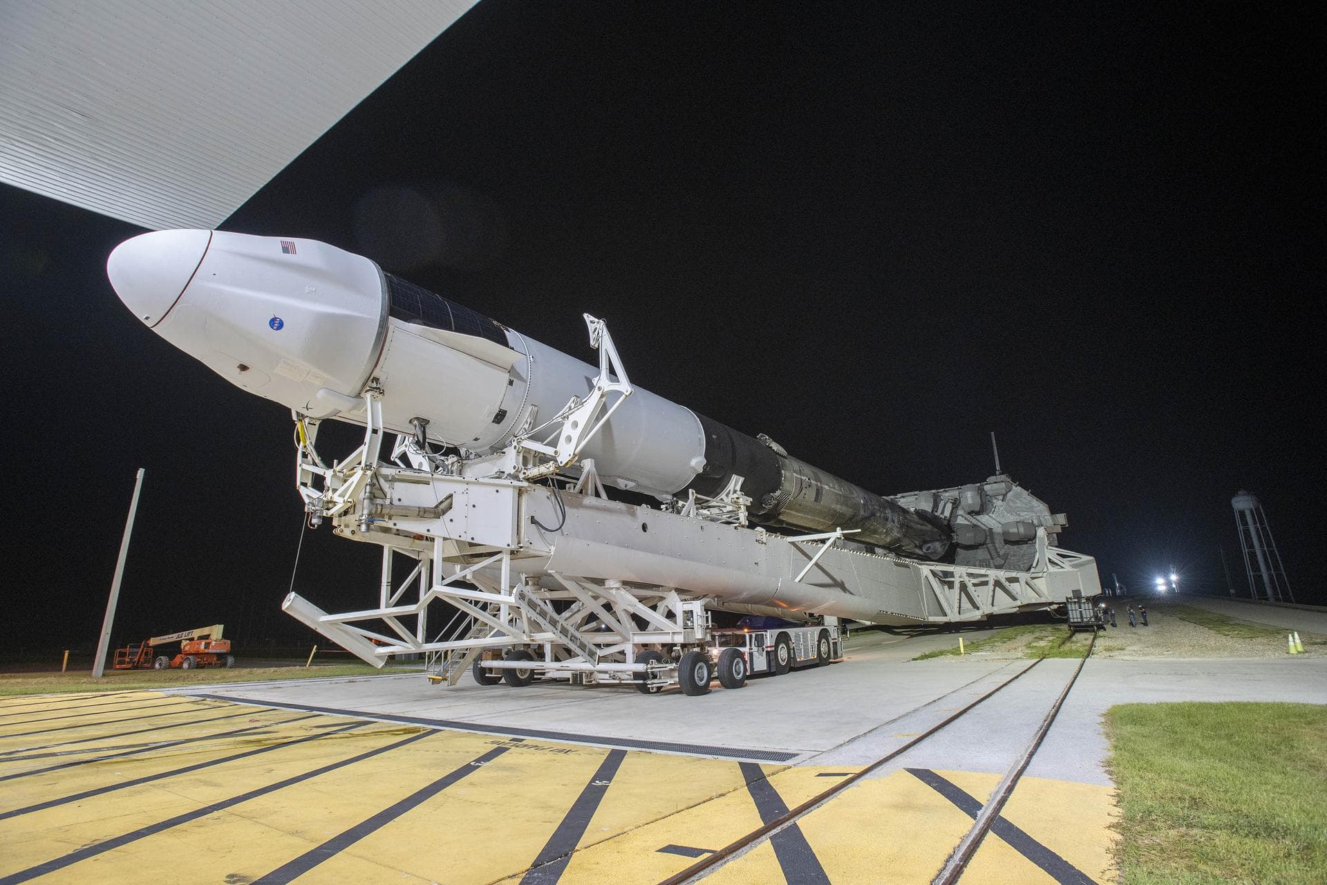 SpaceX’s Dragon spacecraft, seen atop the company’s Falcon 9 rocket, is rolled out to the launch pad at NASA’s Kennedy Space Center in Florida on Aug. 24, 2021, in preparation for the 23rd commercial