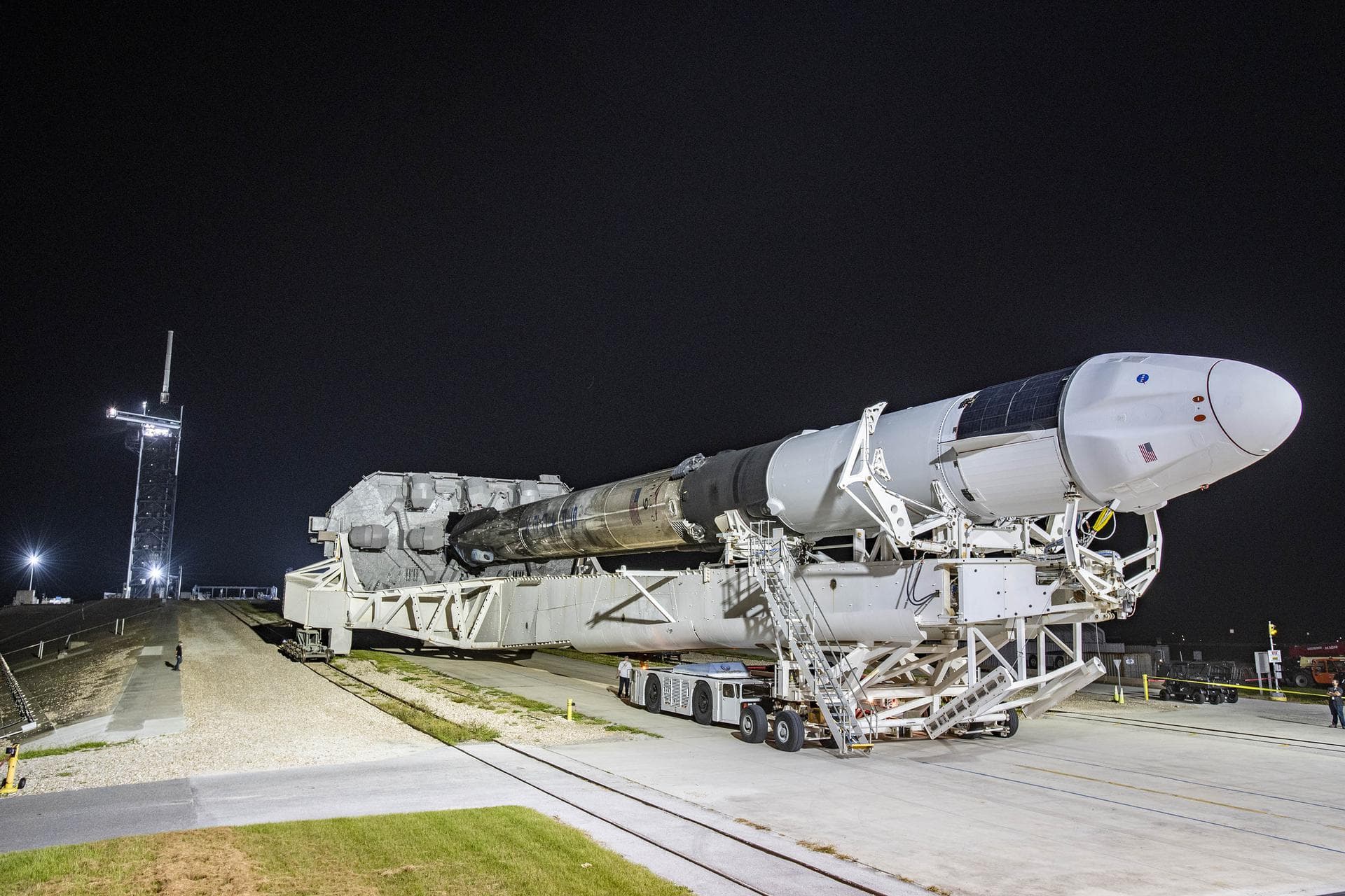 SpaceX’s Dragon spacecraft, seen atop the company’s Falcon 9 rocket, is rolled out to the launch pad at NASA’s Kennedy Space Center in Florida on Aug. 24, 2021, in preparation for the 23rd commercial