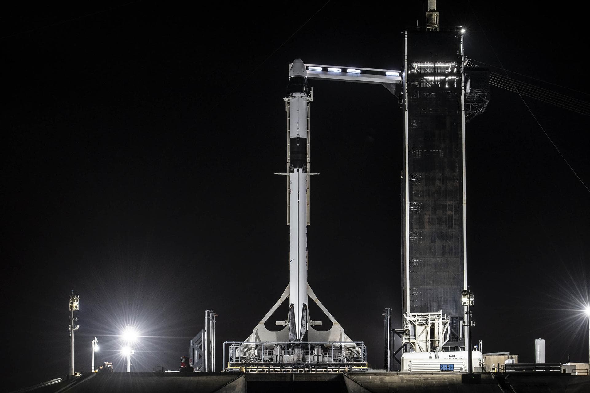 SpaceX's Falcon 9 rocket with Dragon spacecraft rolls out to Launch Complex 39A at NASA's Kennedy Space Center in Florida on Dec. 19, 2021, in preparation for launch. The agency's 24th Commercial Resu