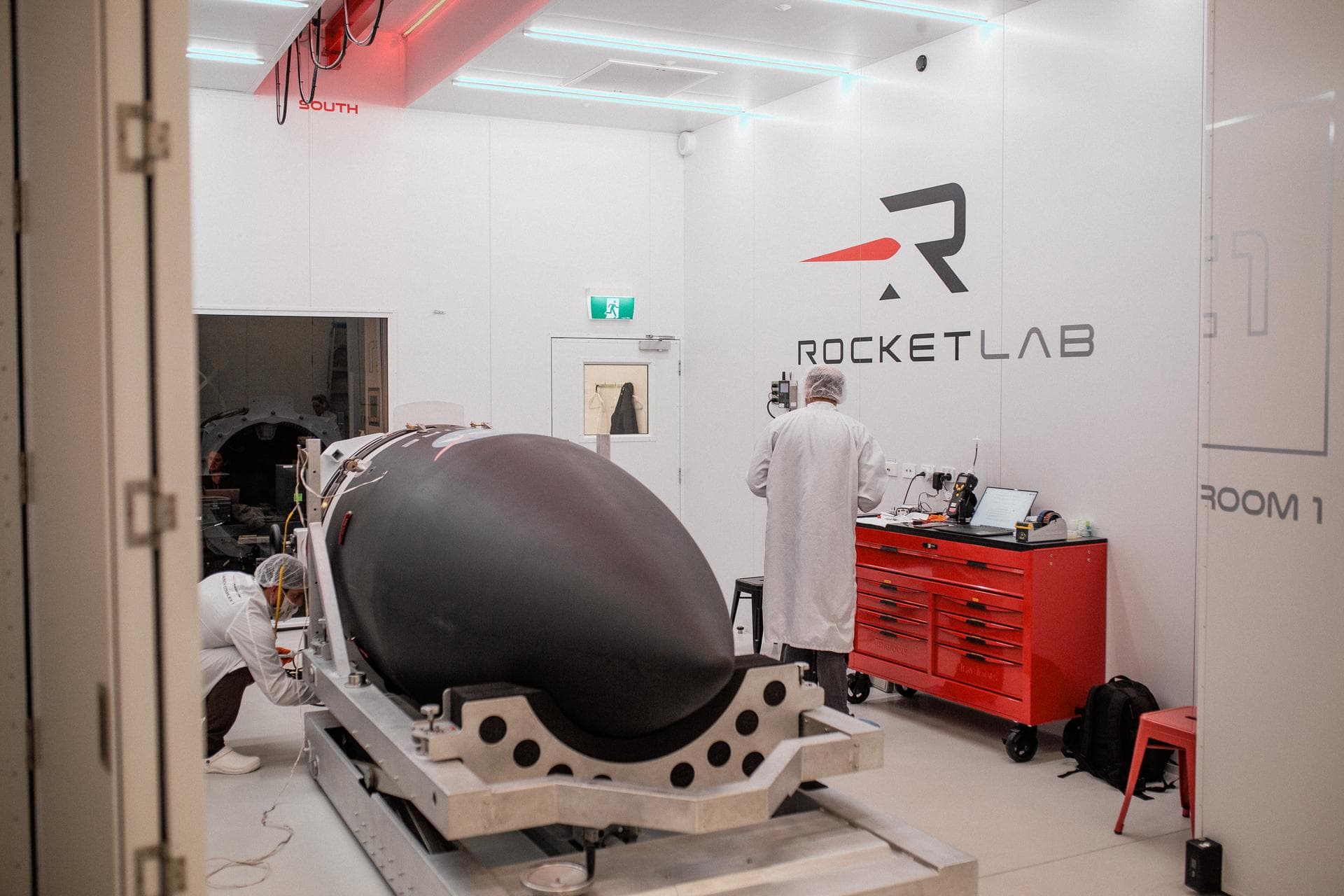 Technicians integrate NASA’s PREFIRE (Polar Radiant Energy in the Far-InfraRed Experiment) payload inside the Rocket Lab Electron rocket payload fairing on Wednesday, May 15, 2024, at the company’s fa