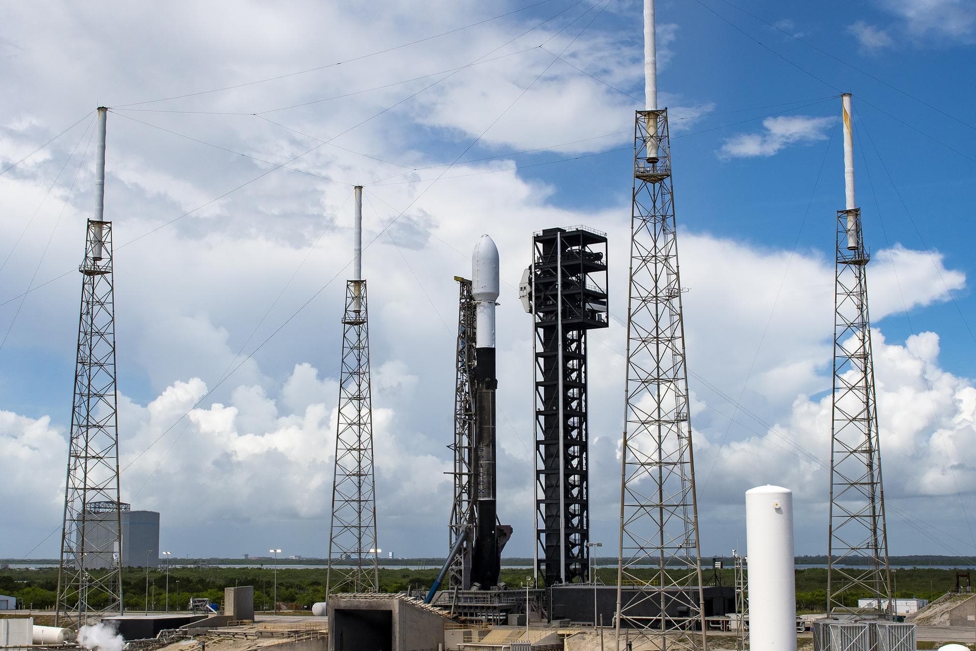 A Northrop Grumman Cygnus resupply spacecraft, atop a SpaceX Falcon 9 rocket, stands tall at Space Launch Complex 40 at Cape Canaveral Space Force Station in Florida on Sunday, Aug. 4, 2024, in prepar