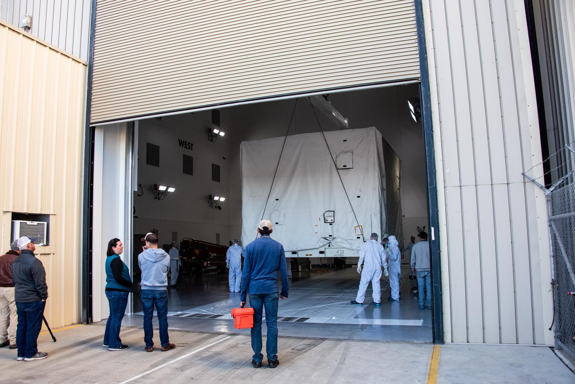 NASA’s SPHEREx (Spectro-Photometer for the History of the Universe, Epoch of Reionization and Ices Explorer), a space telescope, arrives at Vandenberg Space Force Base in California on Tuesday, Jan. 1
