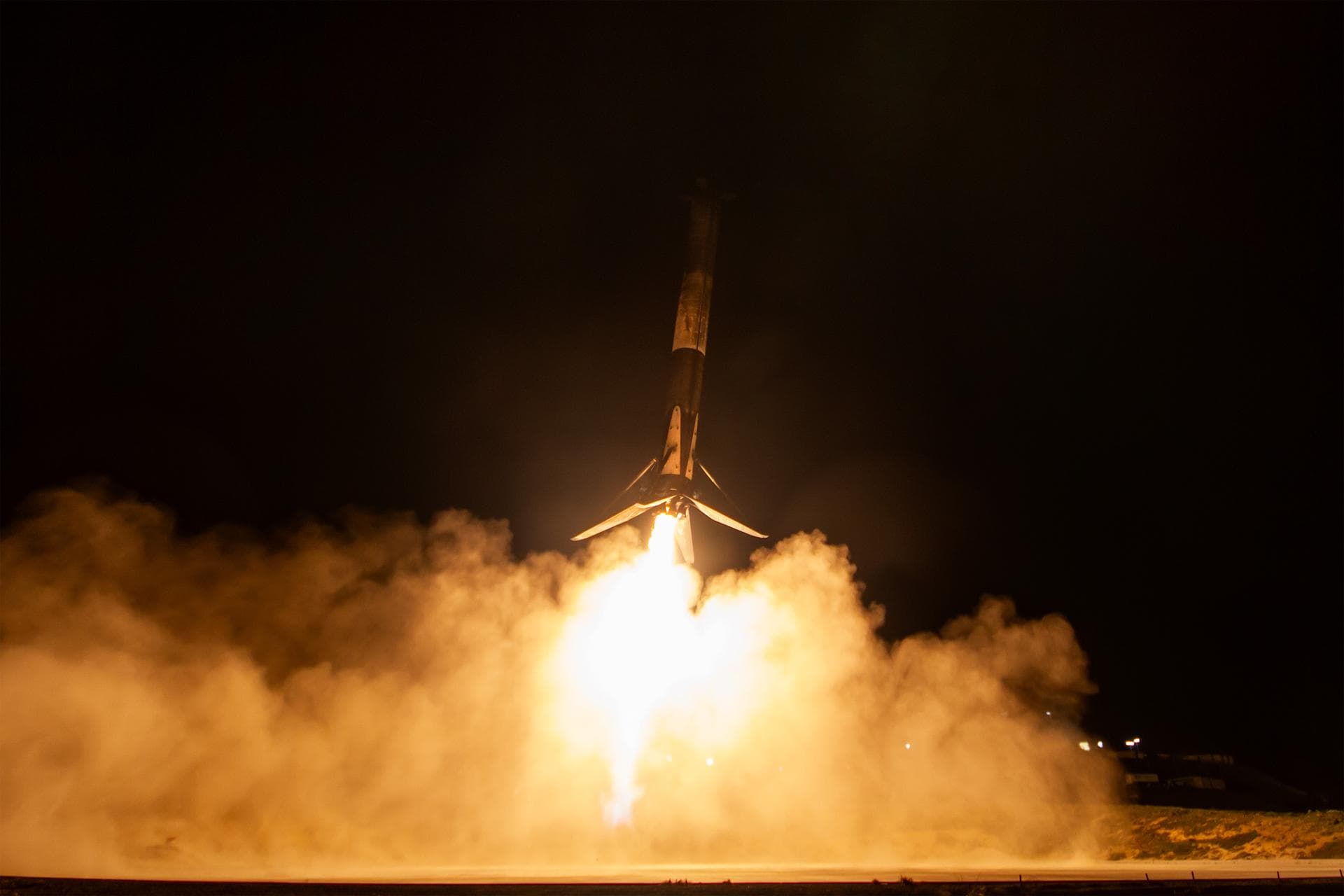 A SpaceX booster prepares for landing following the launch of NASA’s Pandora small satellite, the Star-Planet Activity Research CubeSat (SPARCS), and Black Hole Coded Aperture Telescope (BlackCAT) Cub