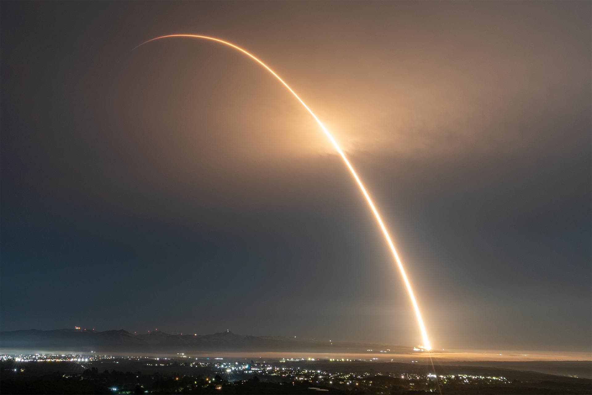 A launch streak captures the liftoff of a SpaceX Falcon 9 rocket carrying several NASA small satellites and instruments from Space Launch Complex 4 East at Vandenberg Space Force Base in California on