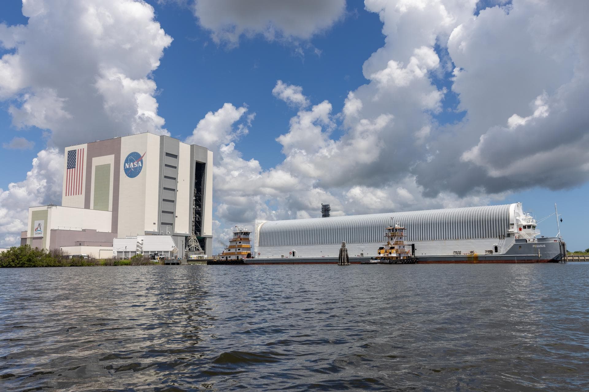 NASA’s Pegasus barge arrives at the Launch Complex 39 turn basin at the agency’s Kennedy Space Center in Florida carrying NASA’s Nancy Grace Roman Space Telescope on Sunday, June 21, 2026. Teams will