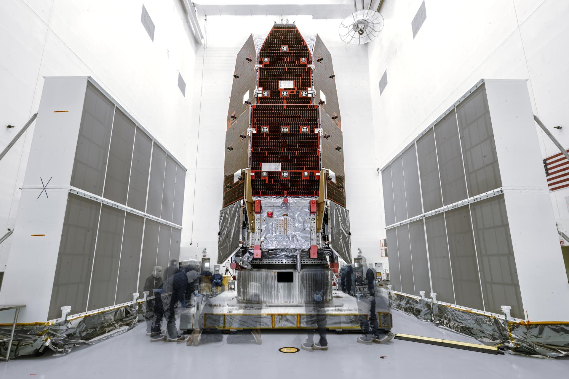 In this long exposure image, members of NASA's Nancy Grace Roman Space Telescope process the observatory on Thursday, July 16, 2026, inside the Payload Hazardous Servicing Facility at NASA’s Kennedy S