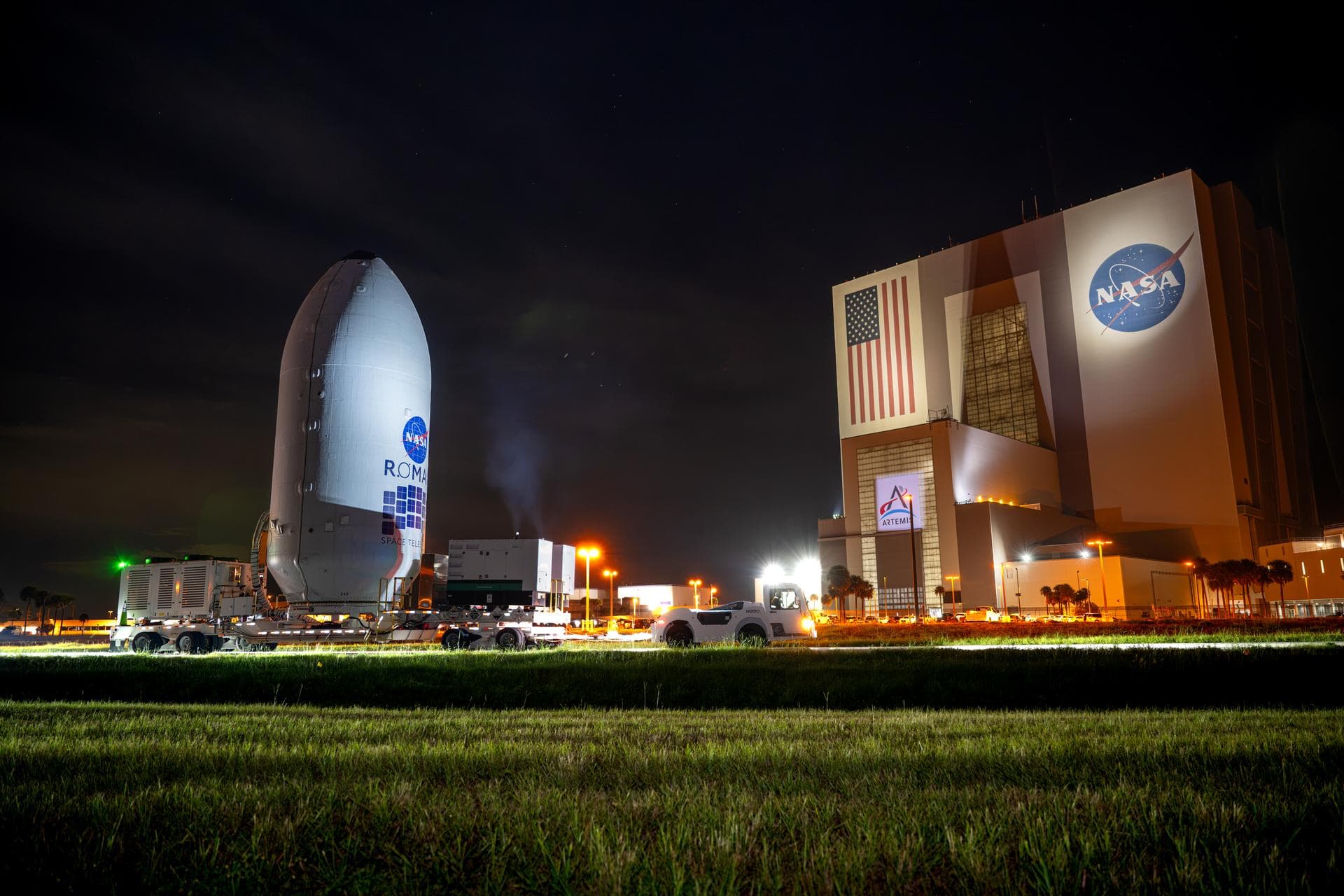 NASA’s Nancy Grace Roman Space Telescope, encapsulated in its payload fairing, travels from the Payload Hazardous Servicing Facility to the SpaceX hangar at Launch Complex 39A at NASA’s Kennedy Space