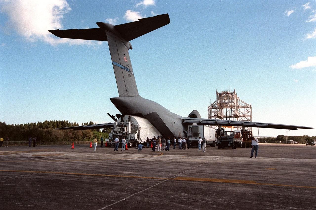 KENNEDY SPACE CENTER, FLA. -- The Chandra X-ray Observatory is unloaded from an Air Force C-5 Galaxy transporter two days after landing at the Shuttle Landing Facility on Feb. 4. The observatory sits