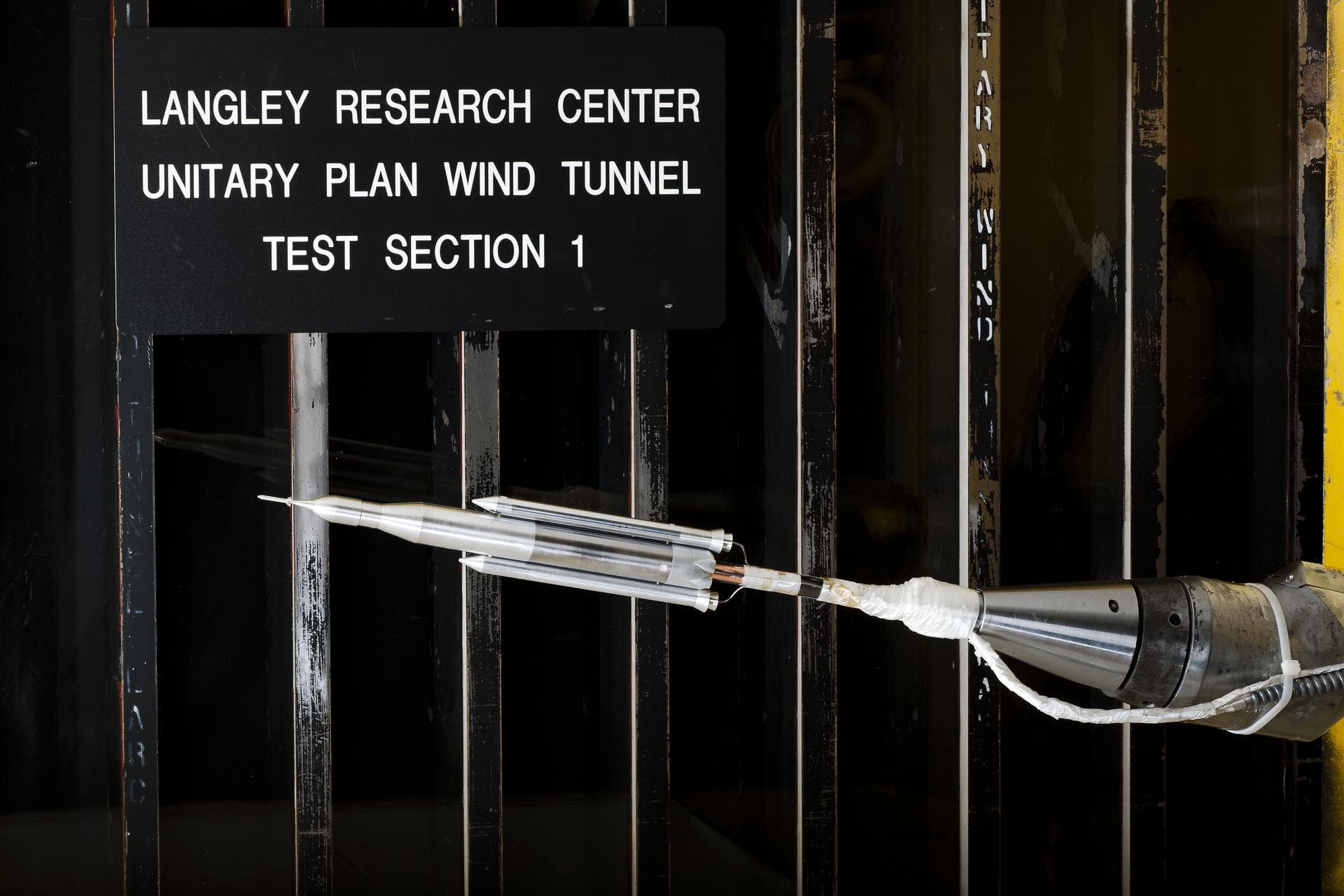 0.4 Percent Scale Space Launch System Wind Tunnel Test 0.4 Percent Scale SLS model installed in the NASA Langley Research Center Unitary Plan Wind Tunnel Test Section 1 for aerodynamic force and move
