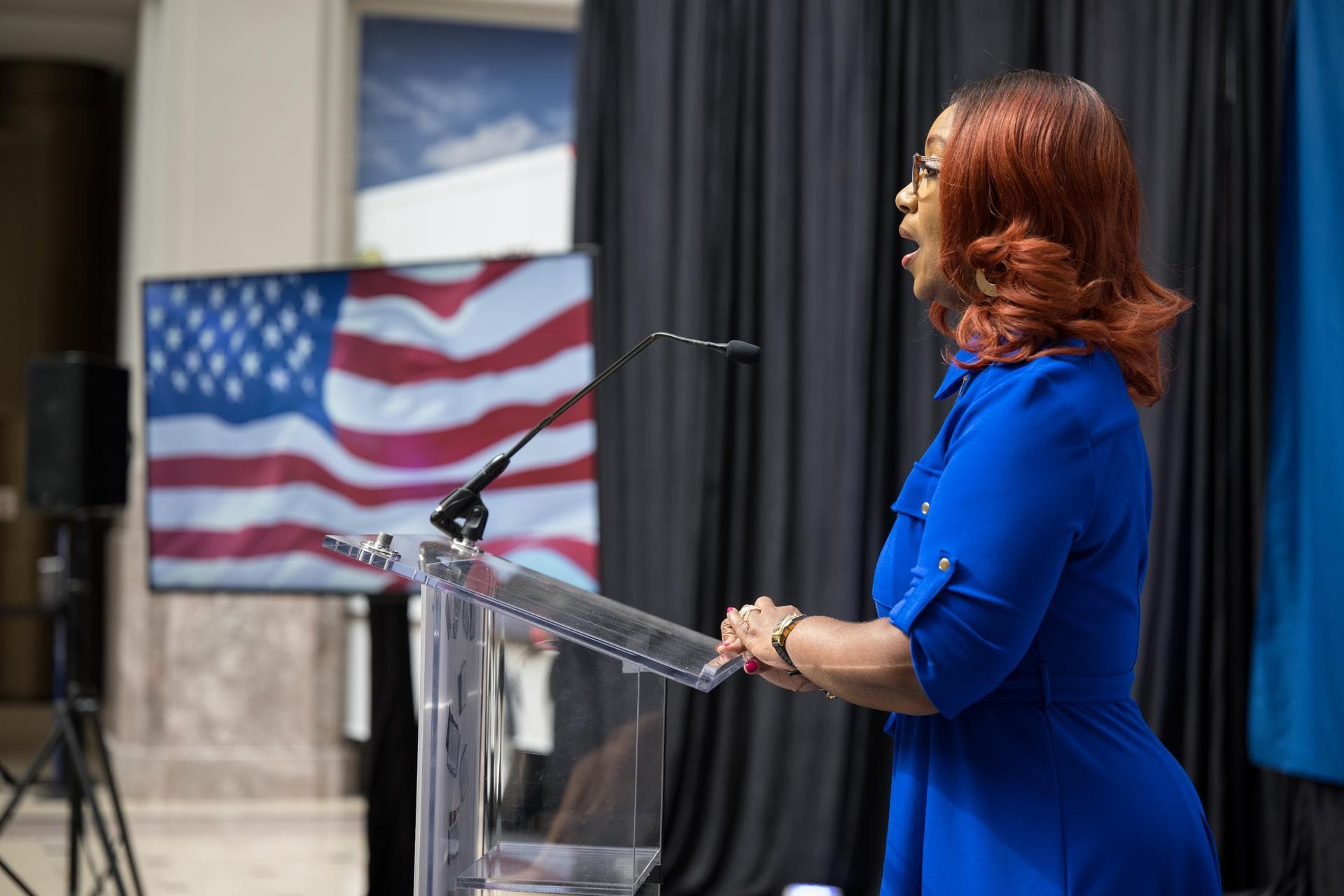Lisa Whitehead of the United States Postal Service sings the national anthem at the first-day-of-issue event for the United States Postal Service’s new stamp celebrating NASA’s James Webb Space Telesc