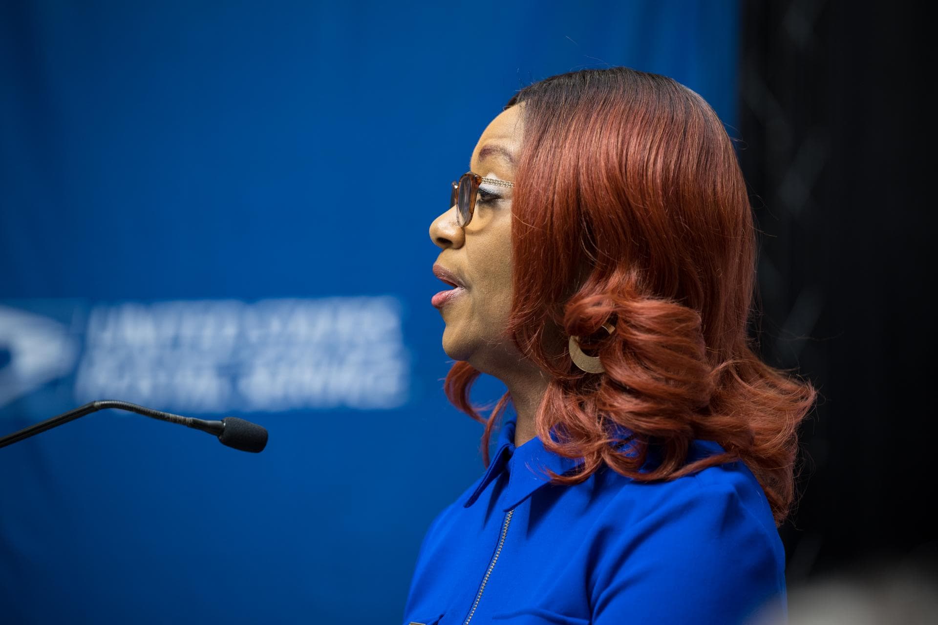 Lisa Whitehead of the United States Postal Service sings the national anthem at the first-day-of-issue event for the United States Postal Service’s new stamp celebrating NASA’s James Webb Space Telesc