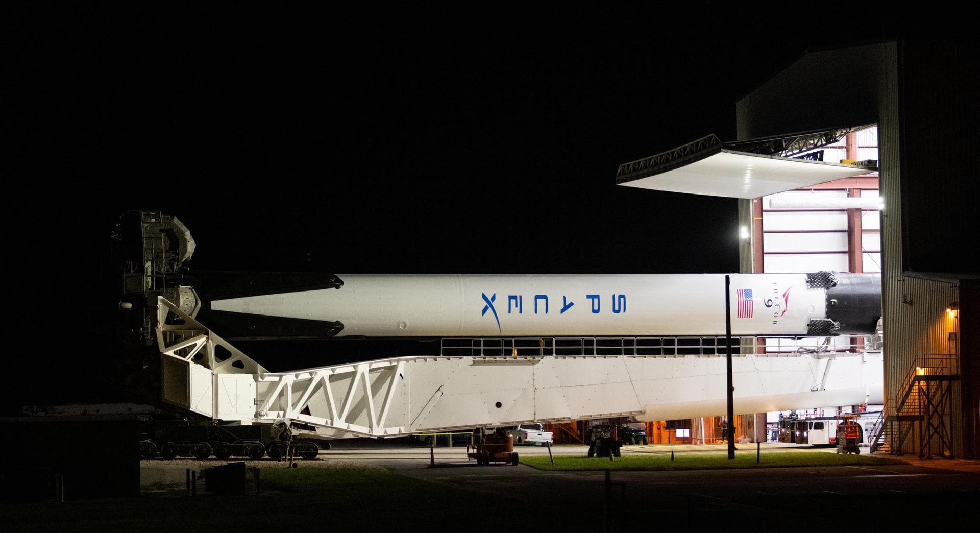 A SpaceX Falcon 9 rocket with the company's Crew Dragon spacecraft onboard is seen as it is rolled out to the launch pad at Launch Complex 39A as preparations continue for the Crew-5 mission, Saturday