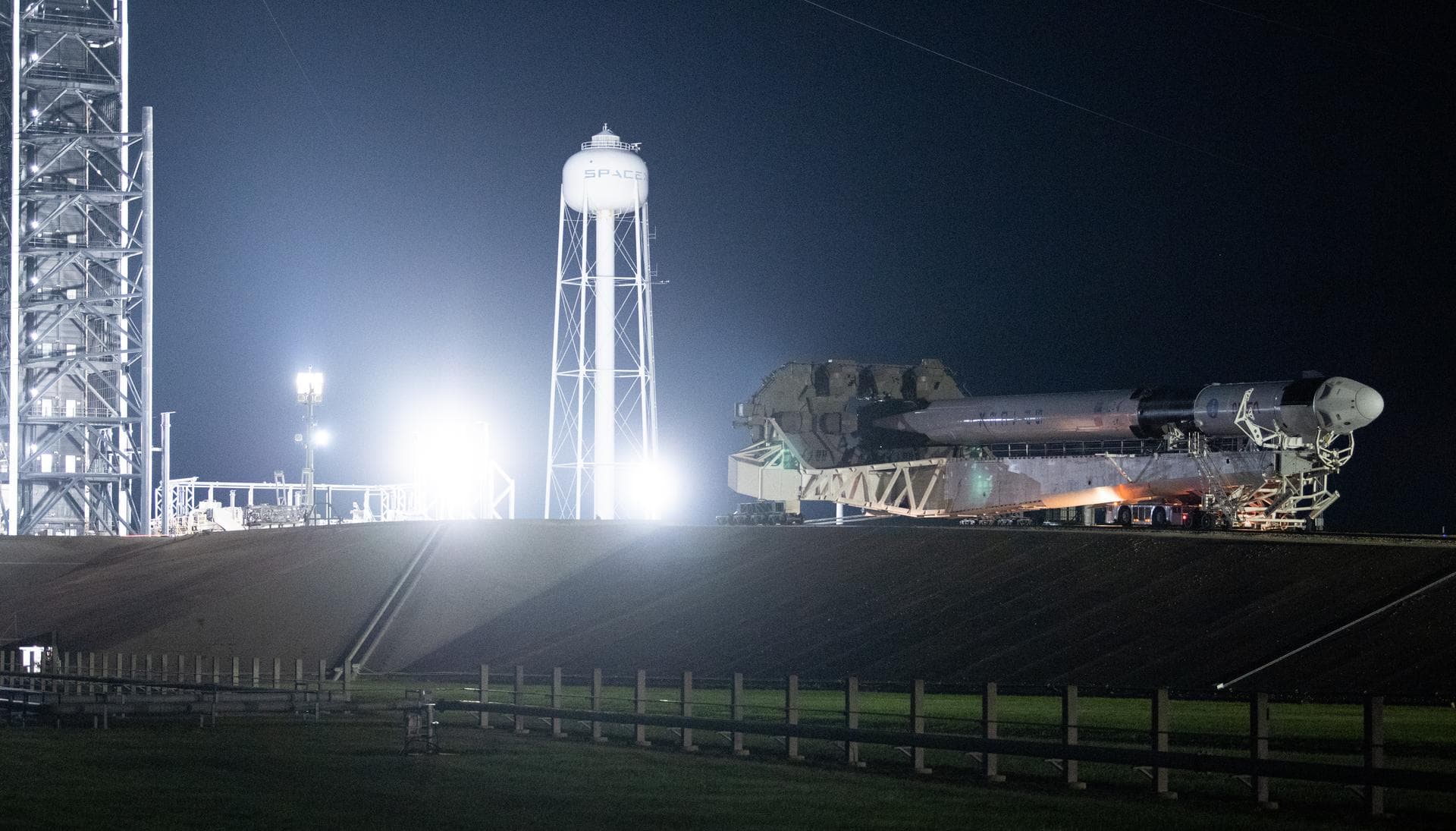 A SpaceX Falcon 9 rocket with the company's Crew Dragon spacecraft onboard is seen as it is rolled out to the launch pad at Launch Complex 39A as preparations continue for the Crew-5 mission, Saturday