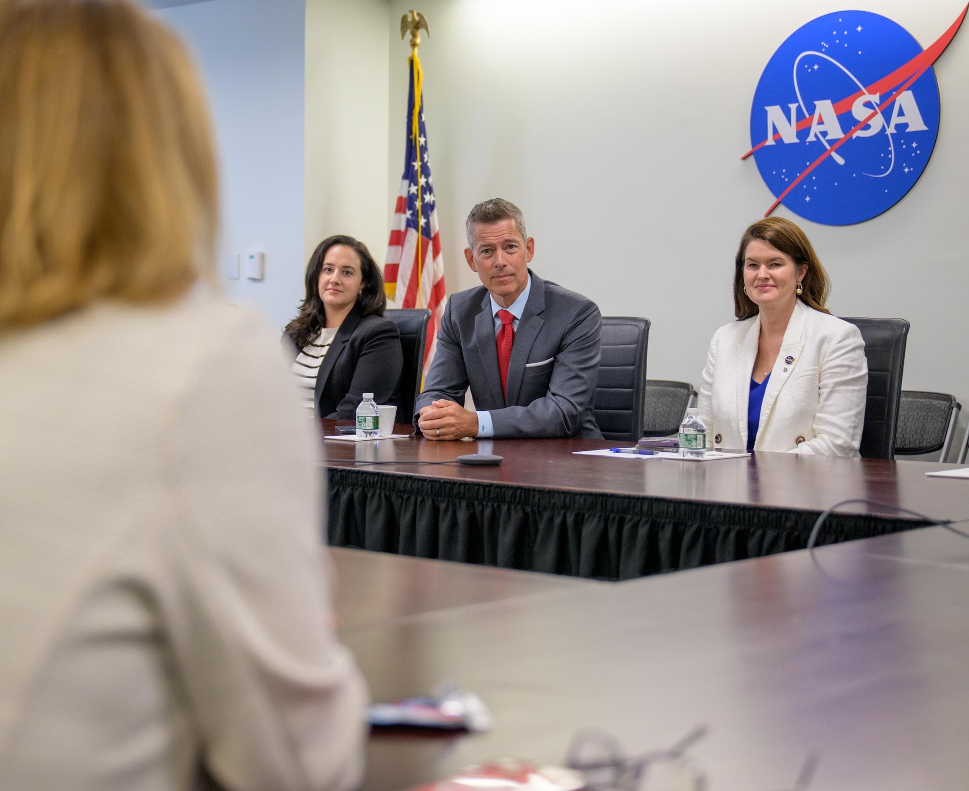 Acting NASA Administrator Sean Duffy, center, along with NASA Deputy Chief of Staff Jacyln Jester, left, and NASA Deputy Associate Administrator Casey Swails, right, speaks with NASA leadership, Frida