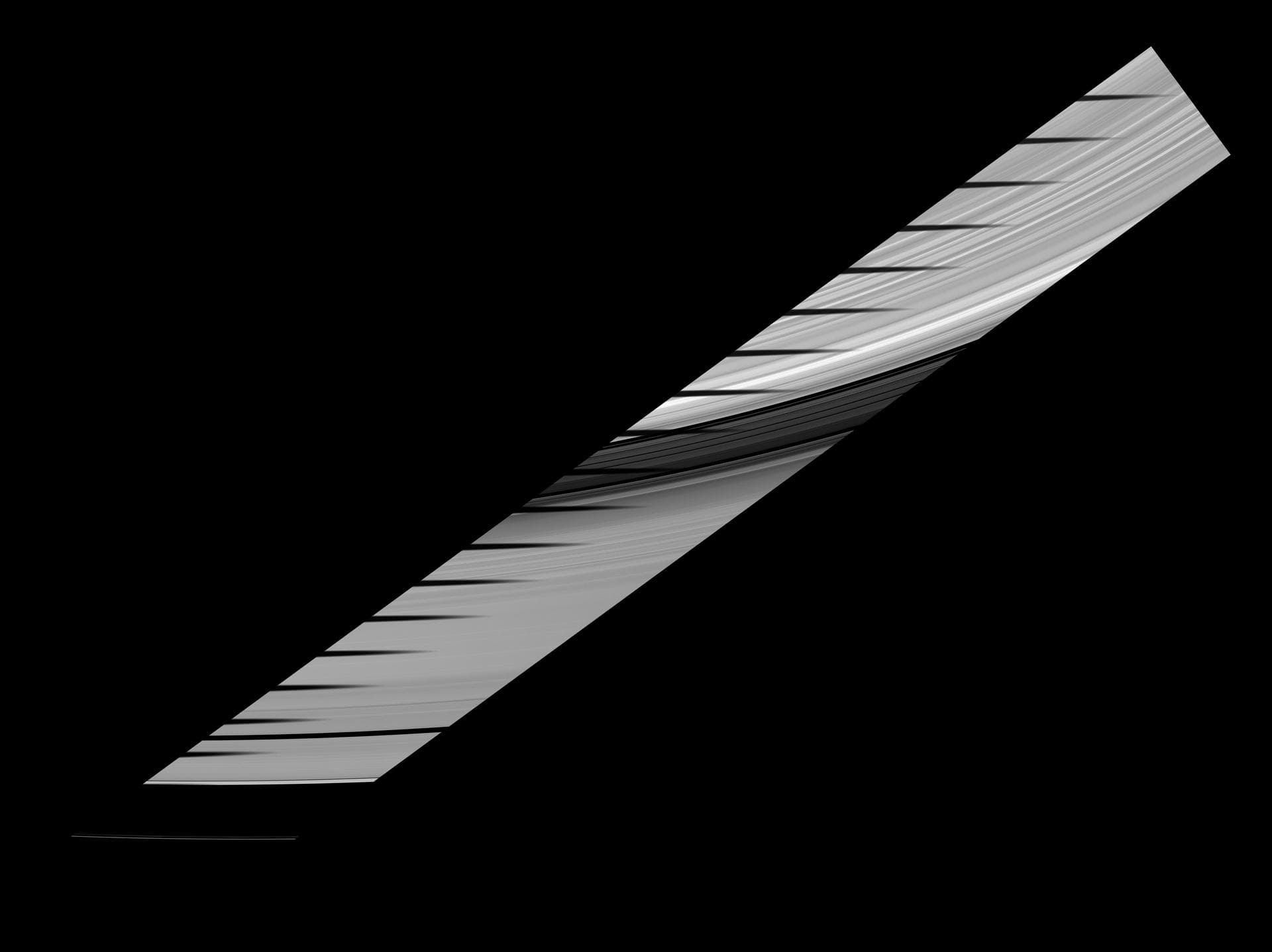 Mimas shadow traverses the sunlit side of Saturn rings in this image and mosaic showcasing the unusual sights seen at Saturn as the planet approaches its August 2009 equinox.