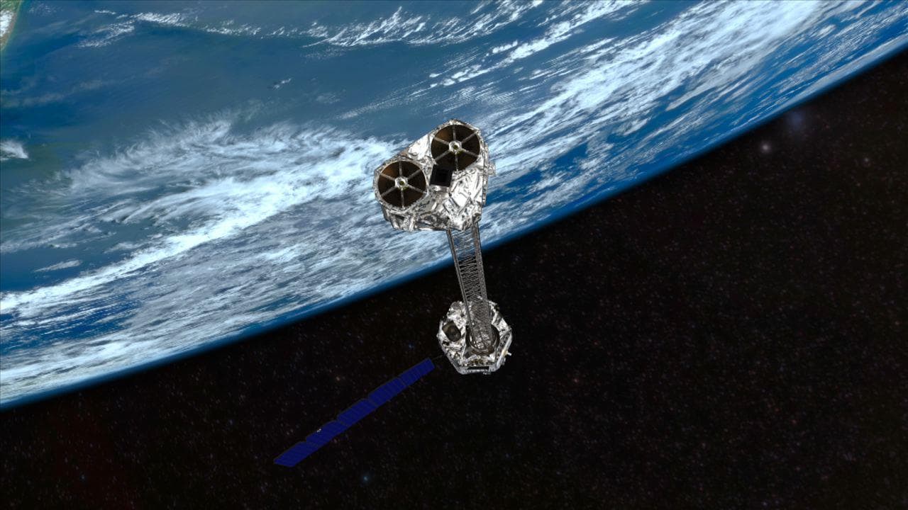 This artist concept shows NASA NuSTAR mission orbiting Earth. NuSTAR will hunt for hidden black holes and other exotic cosmic objects.