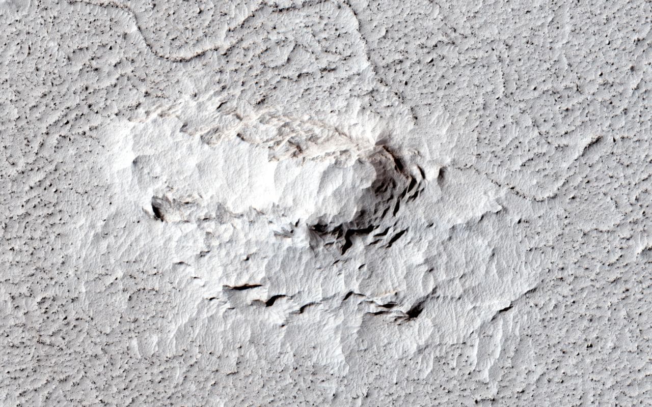 One of the great strengths of the HiRISE camera onboard NASA Mars Reconnaissance Orbiter is that its high resolution can help resolve interesting questions. Here, is the platy flow material younger th