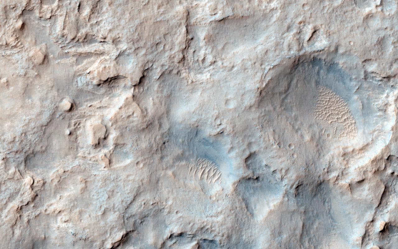 NASA Mars Reconnaissance Orbiter saw the saddle between two valleys named Dingo Gap-in Gale Crater-where the rover Curiosity just traversed. The gap is spanned by a single dune visible both from the g
