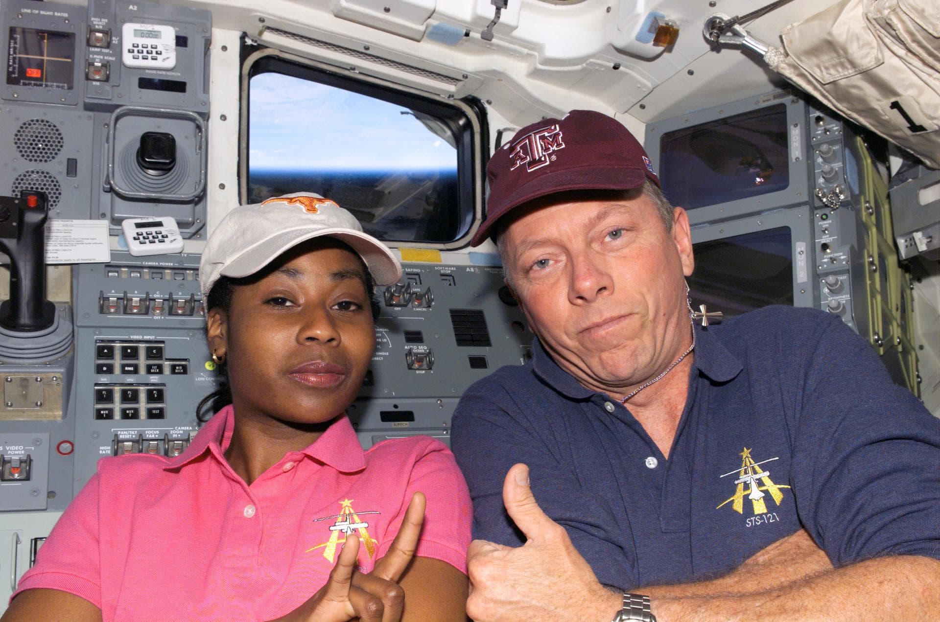 S121-E-08024 (16 July 2006) --- Astronauts Stephanie D. Wilson and Michael E. Fossum, STS-121 mission specialists, pose for a photo on the aft flight deck of the Space Shuttle Discovery. Fossum, a gra